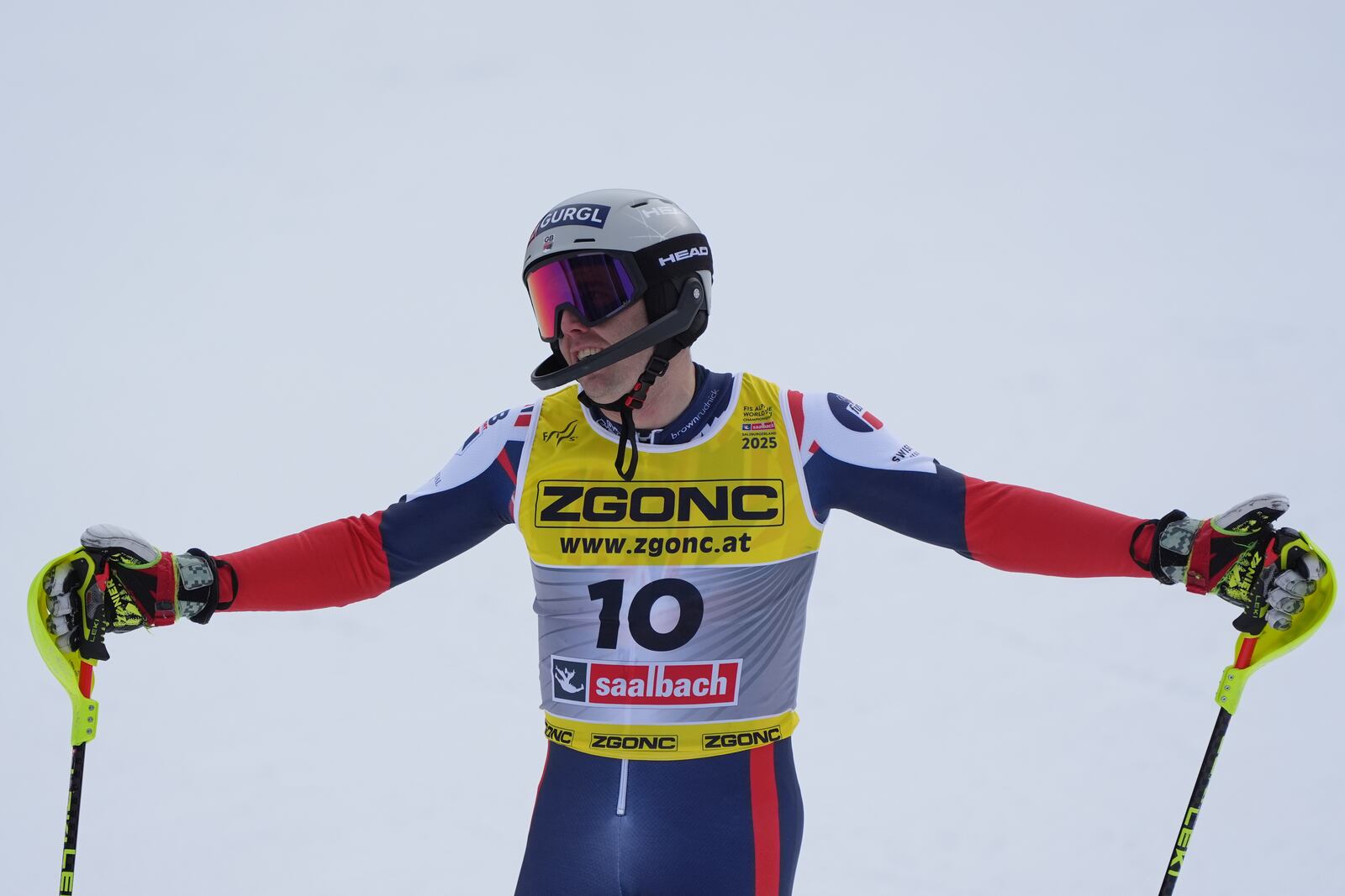 Britain's Dave Ryding celebrates at the finish area of a men's slalom, at the Alpine Ski World Championships, in Saalbach-Hinterglemm, Austria, Sunday, Feb. 16, 2025. (AP Photo/Giovanni Auletta)