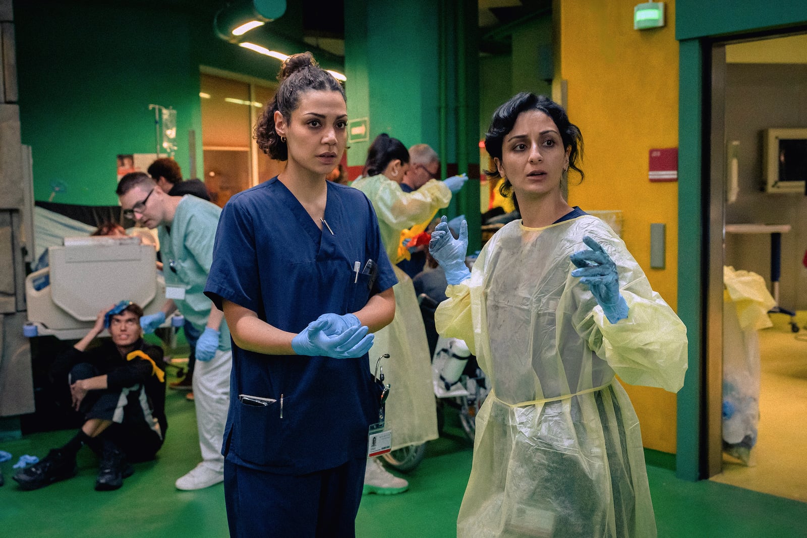 This image released by Apple TV+ shows Haley Louise Jones, left, and Şafak Şengül in a scene from "Berlin ER." (Apple TV+ via AP)