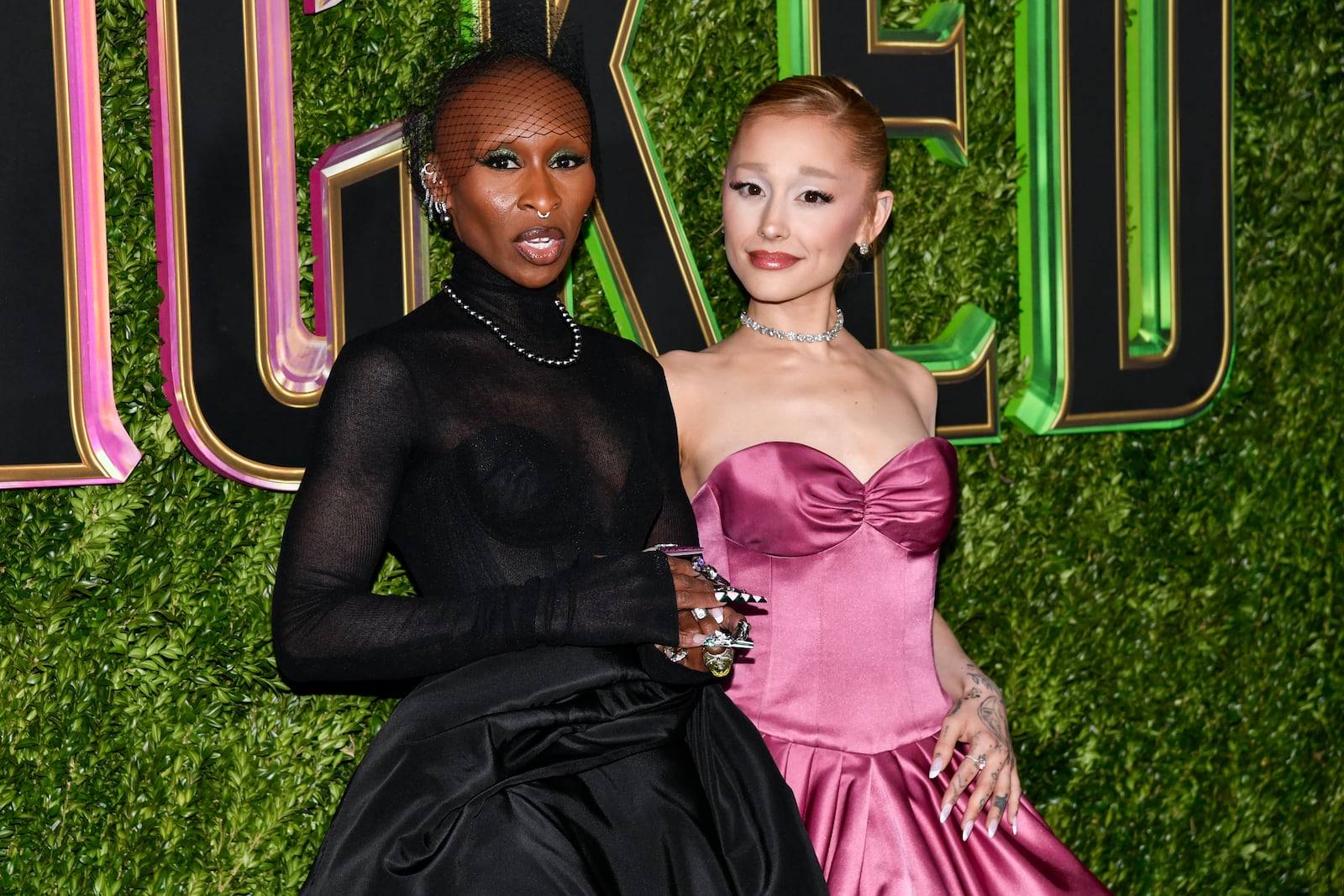 FILE - Cynthia Erivo, left, and Ariana Grande attend the premiere of "Wicked" at the Museum of Modern Art, Nov. 14, 2024, in New York. (Photo by Evan Agostini/Invision/AP, File)