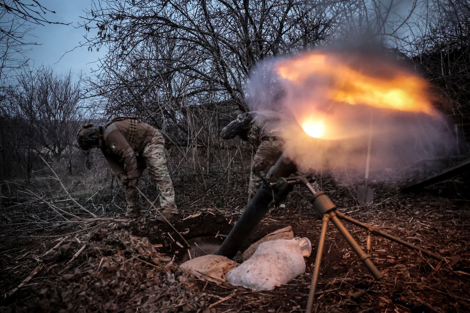 In this photo taken on March 16, 2025 and provided by Ukraine's 24th Mechanized Brigade press service, Ukrainian soldiers fire 120mm mortar towards Russian army positions near Chasiv Yar, Donetsk region, Ukraine, Sunday, March 16, 2025. (Oleg Petrasiuk/Ukraine's 24th Mechanized Brigade via AP)