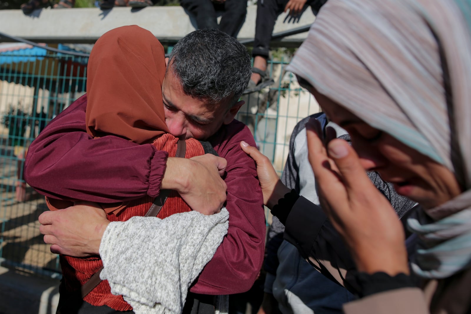 A freed Palestinian prisoner hugs a relative as he arrives in the Gaza Strip after being released from an Israeli prison following a ceasefire agreement between Hamas and Israel in Khan Younis, Saturday, Feb. 1, 2025. (AP Photo/Jehad Alshrafi)