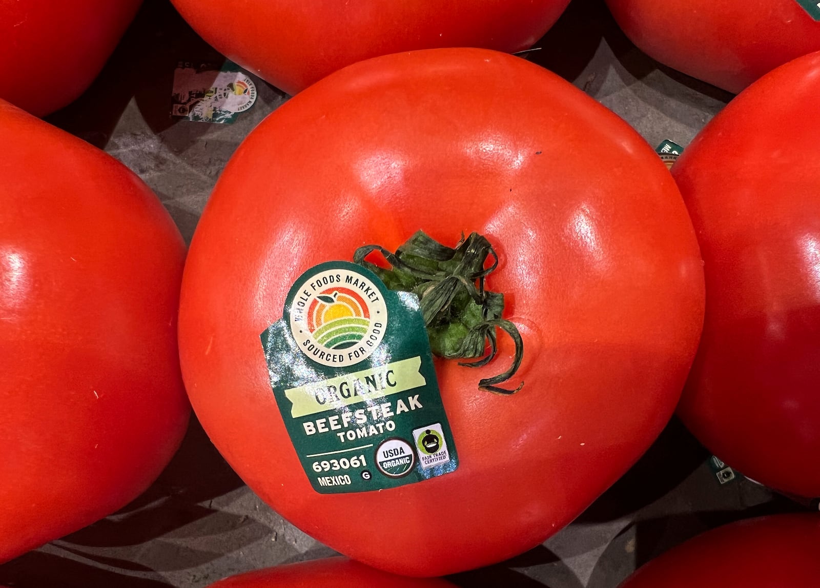 Tomatoes imported from Mexico are for sale in a supermarket in Miami as the United States imposed 25% tariffs on goods from Canada and Mexico, starting a trade war with its closest neighbors and allies Wednesday, March 5, 2025. (AP Photo/Lynne Sladky)