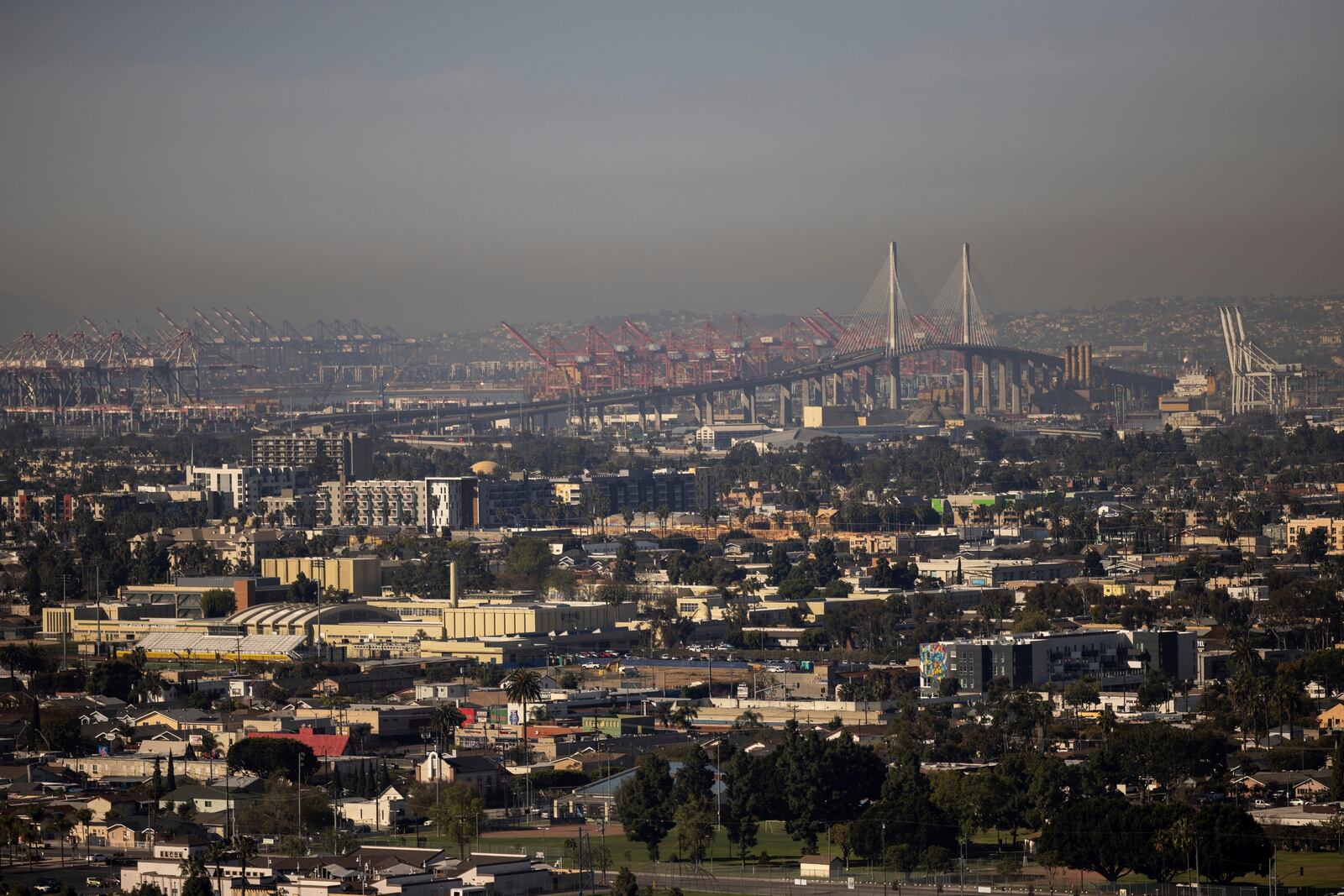 A layer of smog lingers over the Ports of Long Beach and Los Angeles on Monday, March 10, 2025, as seen from Signal Hill, Calif. (AP Photo/Etienne Laurent)