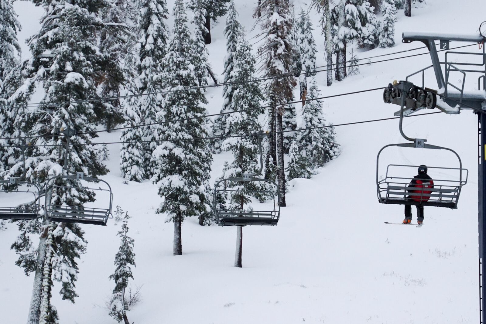 A lone skier rides on a lift Thursday, Nov. 21, 2024, at Sugar Bowl Ski Resort in Norden, Calif. (AP Photo/Brooke Hess-Homeier)