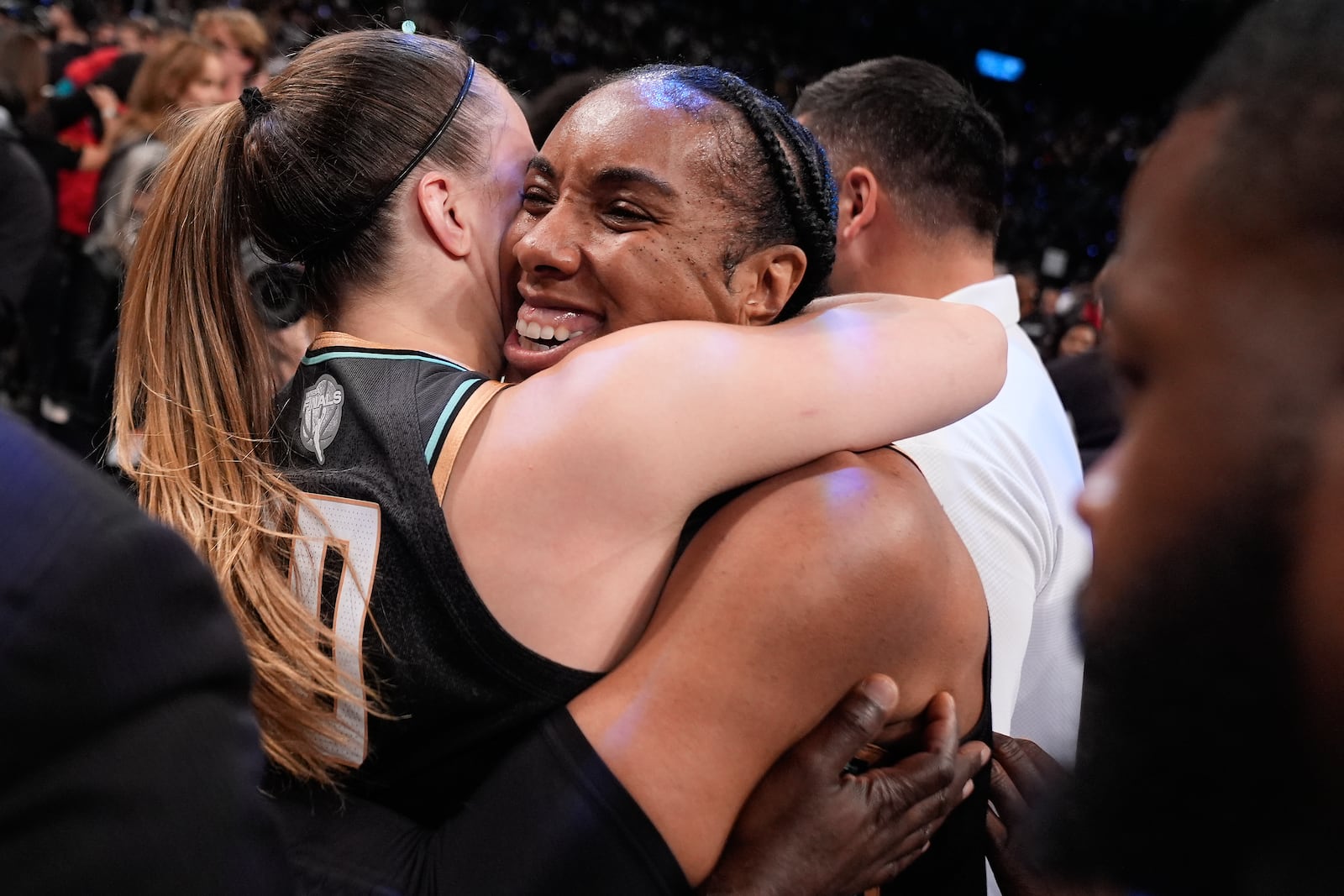 New York Liberty forward Kayla Thornton (5) hugs guard Sabrina Ionescu (20) after the Liberty defeated the Minnesota Lynx in Game 5 of the WNBA basketball final series to win the championship, Sunday, Oct. 20, 2024, in New York. (AP Photo/Pamela Smith)