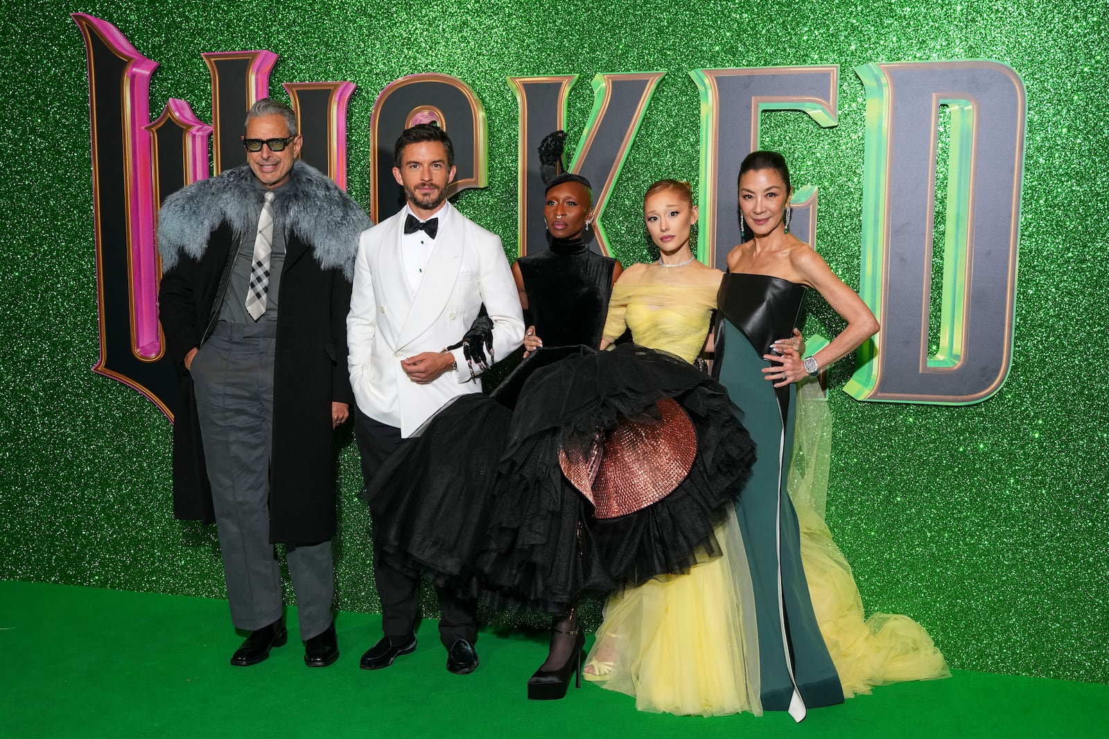 Jeff Goldblum, from left, Jonathan Bailey, Cynthia Erivo, Ariana Grande and Michelle Yeoh pose for photographers upon arrival at the premiere of the film 'Wicked' on Monday, Nov. 18, 2024, in London. (Photo by Scott A Garfitt/Invision/AP)