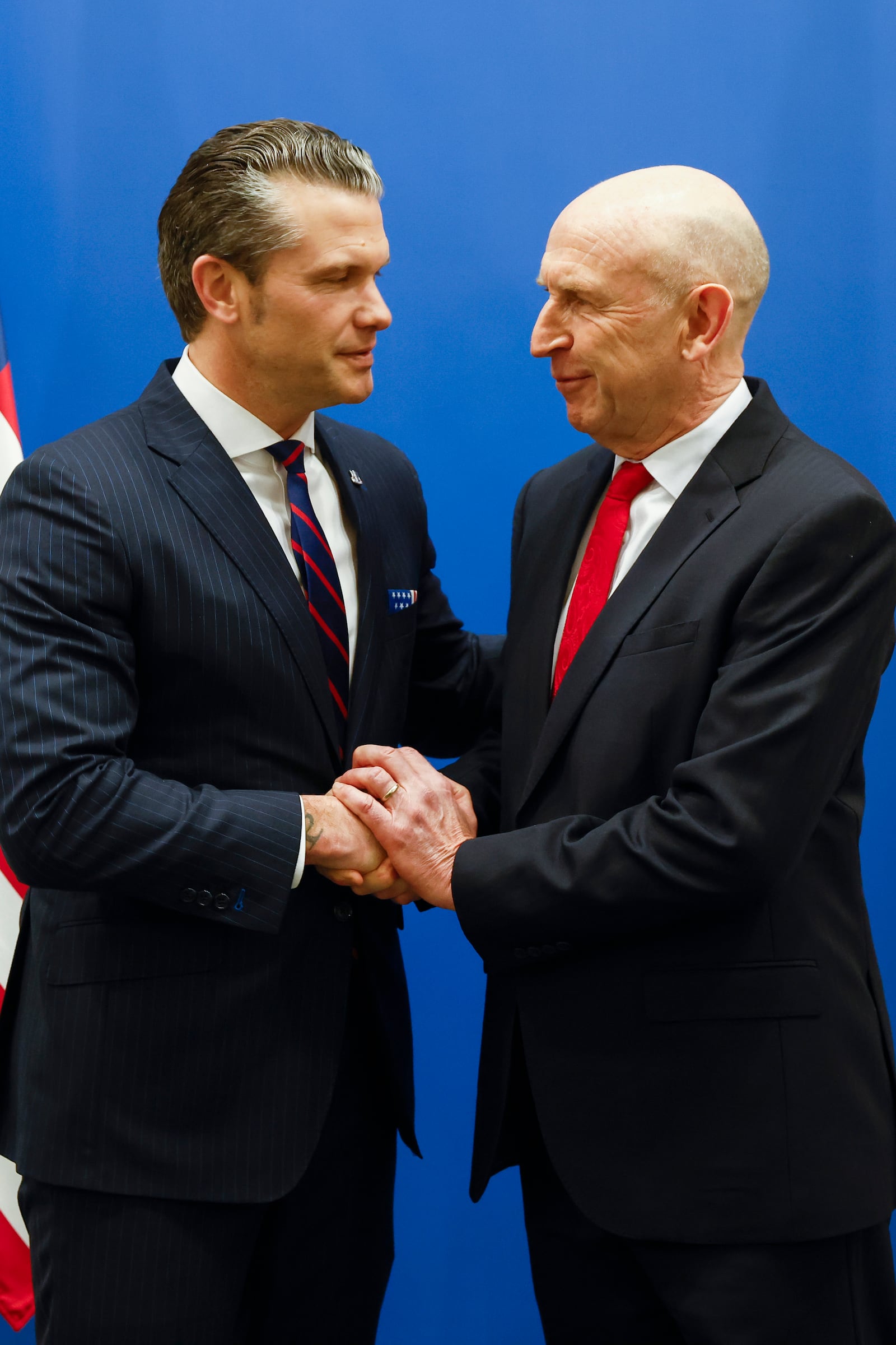 United States Secretary of Defense Pete Hegseth, left, shakes hands with Britain's Defense Secretary John Healey prior to a bilateral meeting on the sidelines of a NATO defense ministers meeting at NATO headquarters in Brussels, Wednesday, Feb. 12, 2025. (Johanna Geron, Pool Photo via AP)