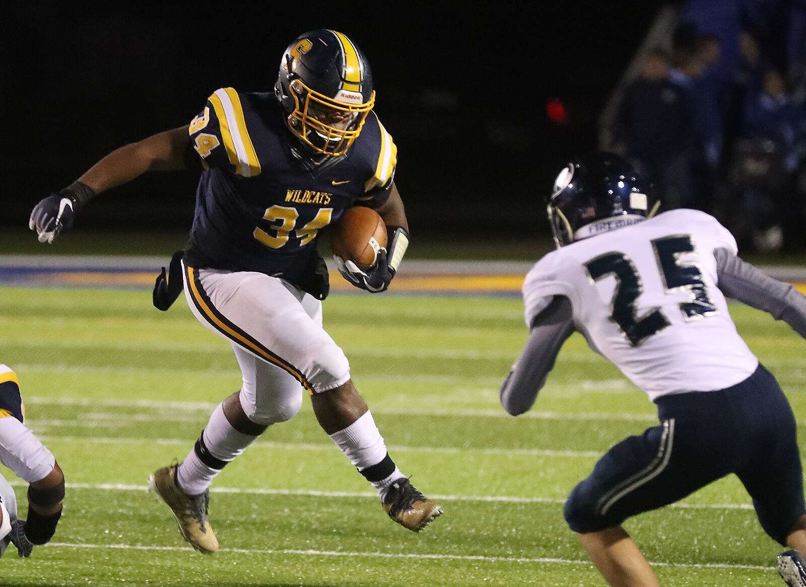 Springfield's Tay'Veon Smoot tries to avoid a tackle by Fairmont's Chase Fugate. BILL LACKEY/STAFF