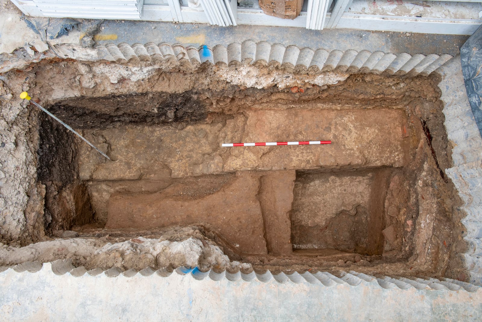 In this photo provided by MOLA, Museum of London Archaeology taken in summer 2024, a view of part of the wall of the Roman London Basilica which has been recently unearthed by a redevelopment of a City of London building in London. (MOLA via AP)