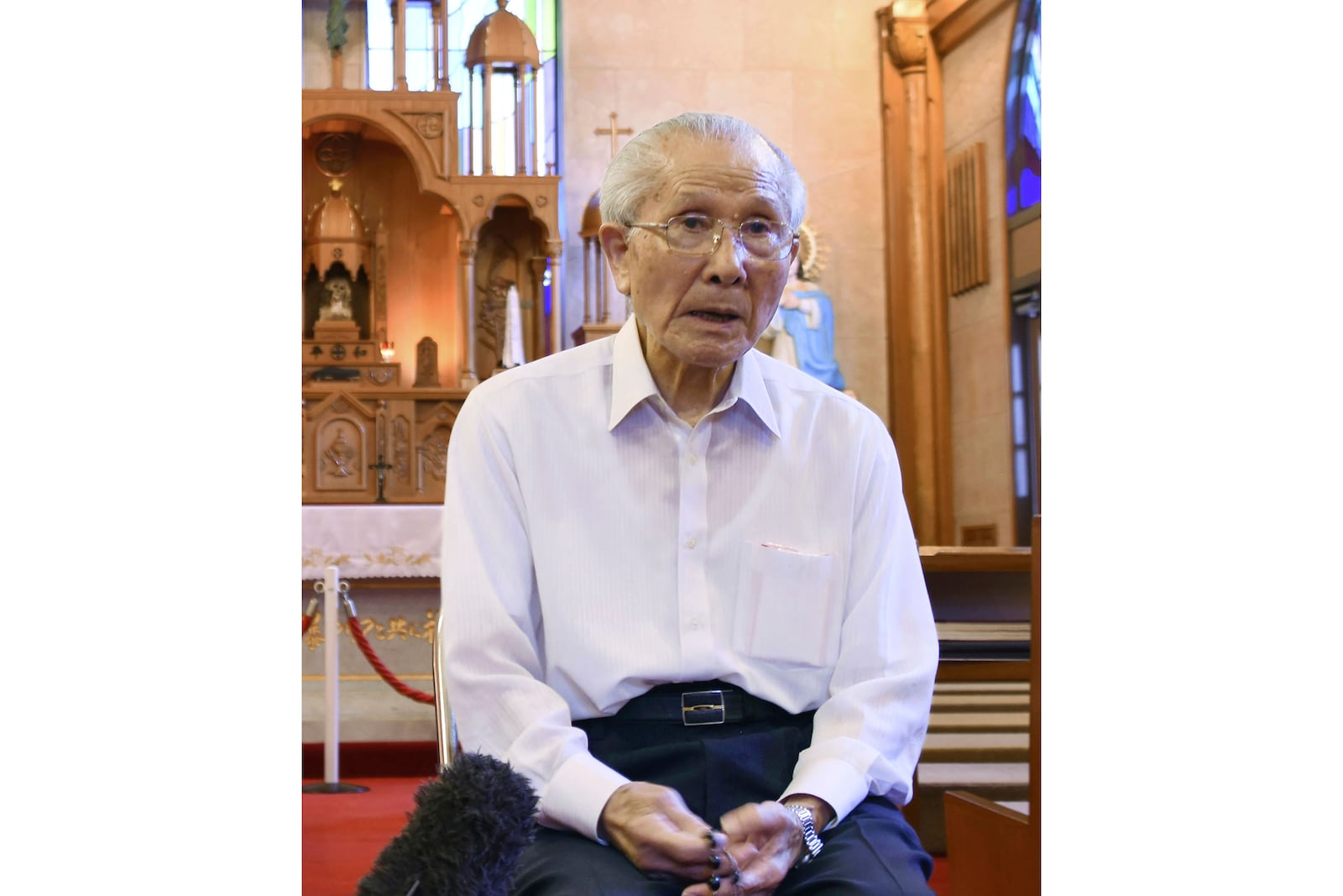 FILE - Shigemi Fukahori is interviewed at the Urakami Cathedral in Nagasaki, southern Japan, on July 29, 2020. Shigemi Fukahori, a survivor of the 1945 Nagasaki atomic bombing, who devoted his life to praying for peace and the souls of the victims, has died. He was 93. (Kyodo News via AP, File)