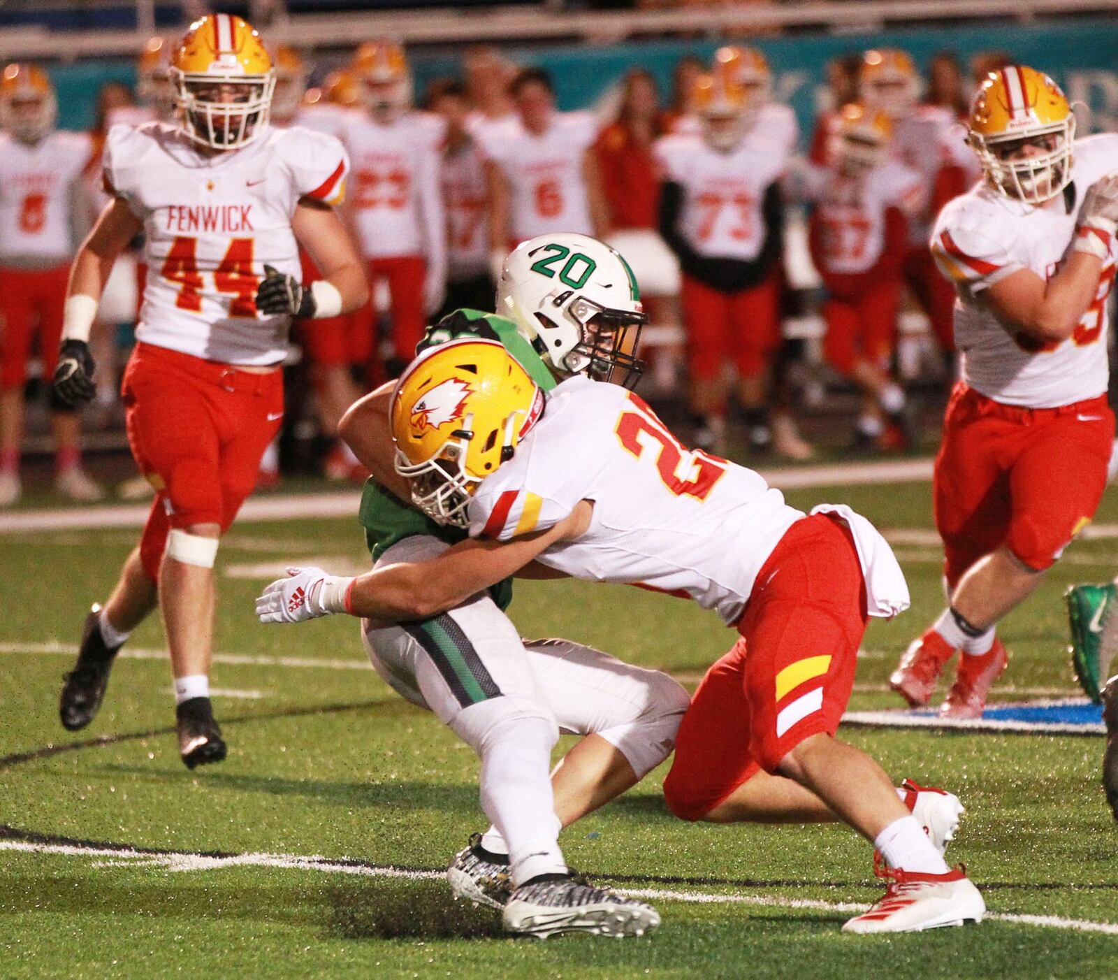 Logan Miller of Fenwick meets Alex DeLong of Badin. Badin defeated visiting Fenwick 34-6 in a Week 8 high school football game at Virgil Schwarm Stadium on Friday, Oct. 18, 2019. MARC PENDLETON / STAFF