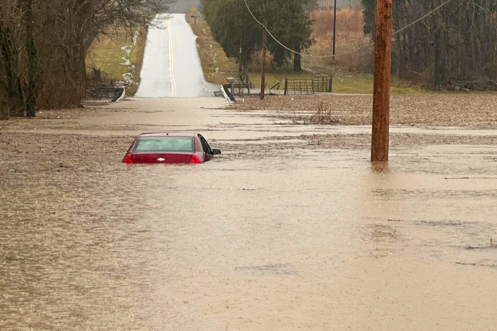 This photo provided by the Warren County, Ky., Sheriff's Office shows a partially submerged car outside of Bowling Green, Ky., on Saturday, Feb. 15, 2025. (Warren County Sheriff's Office via AP)