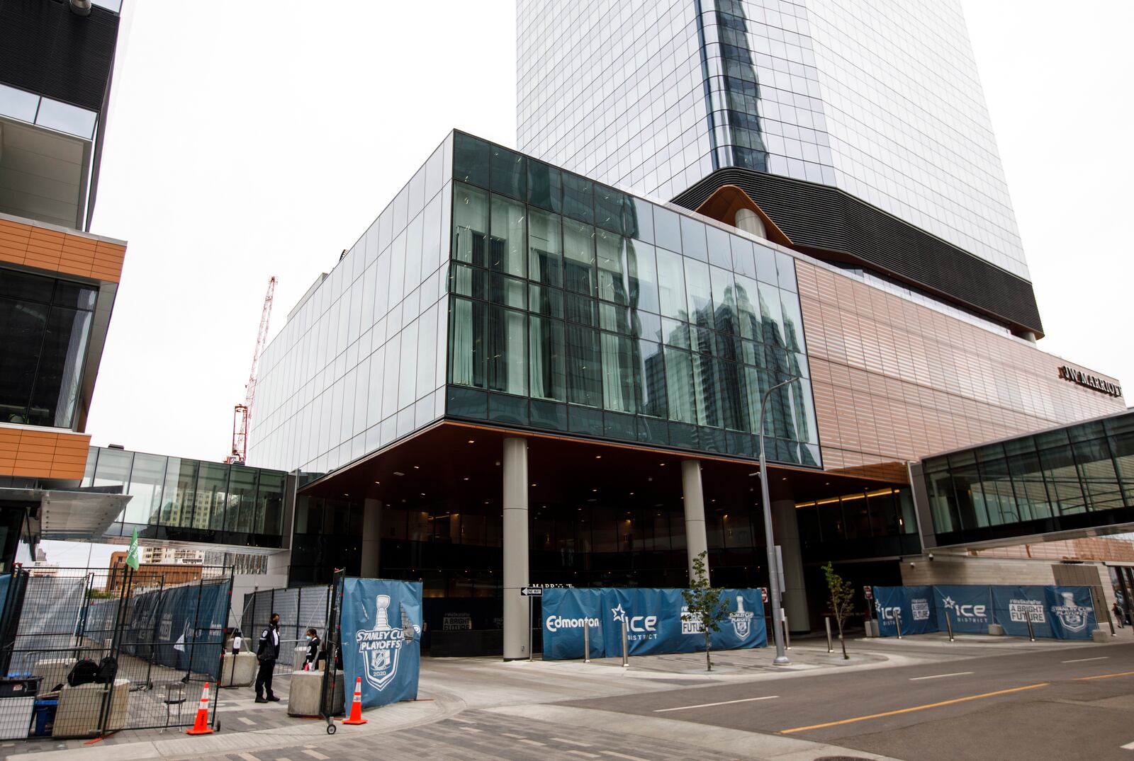 FILE - The JW Marriott, surrounded by fencing, is part of the bubble during the NHL Western Conference Stanley Cup hockey playoffs in Edmonton, Alberta, Monday, Aug. 24, 2020. (Jason Franson/The Canadian Press via AP)