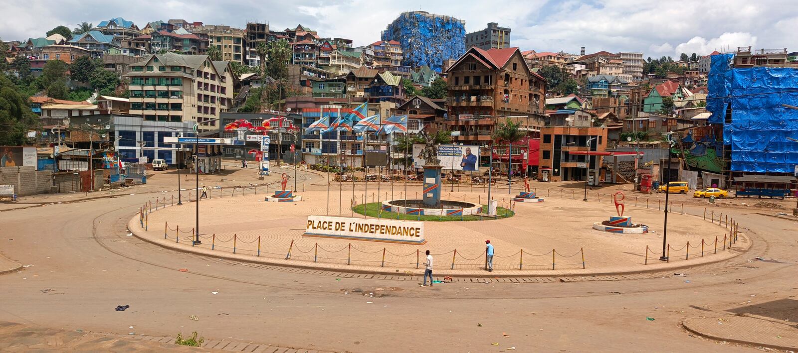 People walk past an independence square in Bukavu, eastern Congo, Saturday, Feb. 15, 2025. (AP Photo/Janvier Barhahiga)