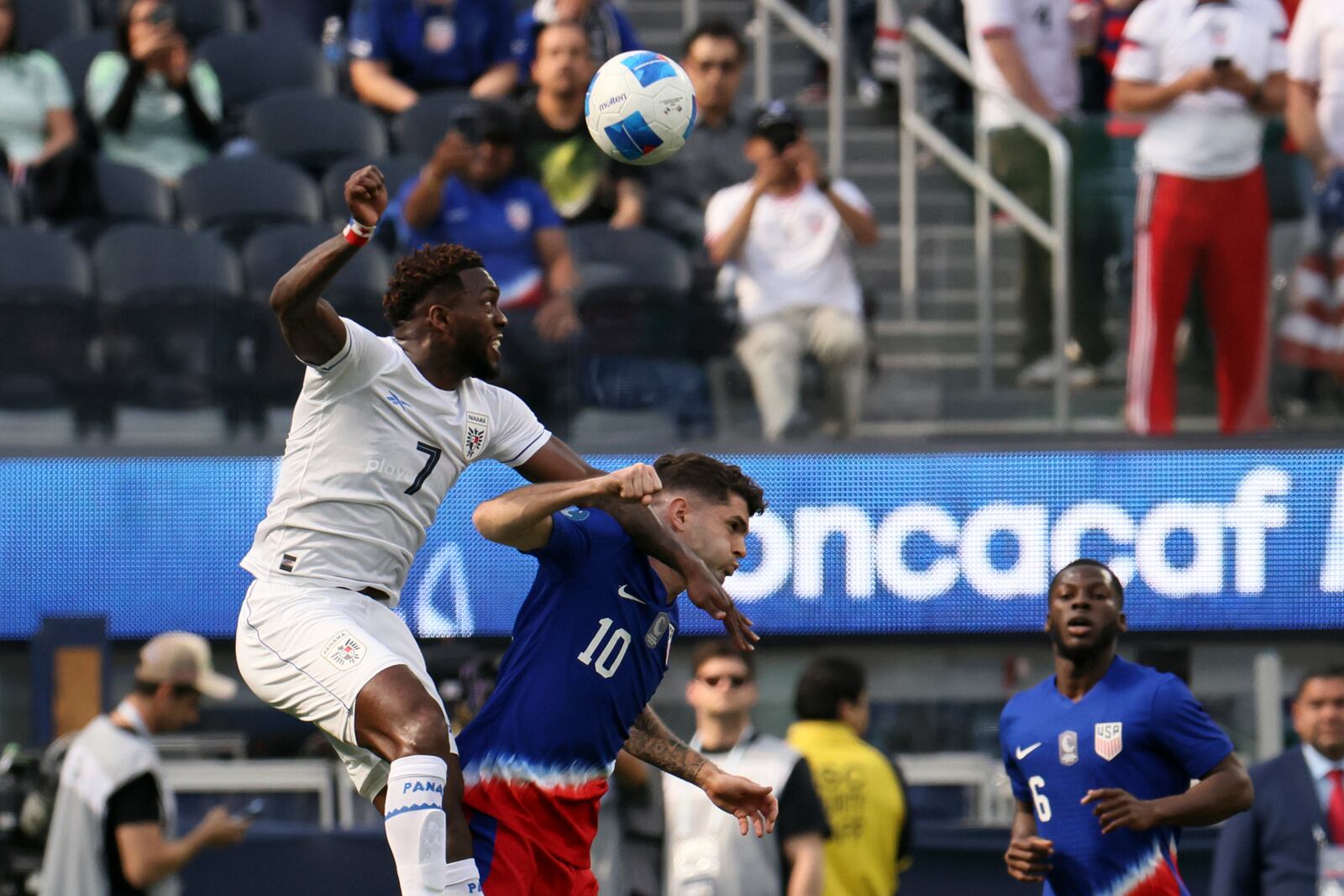 Panama's Jose Rodriguez Francis, left, vies for the ball against United States' Christian Pulisic (10) during the first half of a CONCACAF Nations League semifinal soccer match Thursday, March 20, 2025, in Inglewood, Calif. (AP Photo/Etienne Laurent)