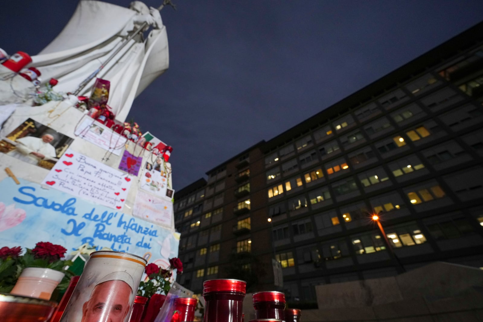 Candles for Pope Francis are seen in front of the Agostino Gemelli Polyclinic, in Rome, Friday, March 7, 2025, where the Pontiff is hospitalized since Friday, Feb. 14. (AP Photo/Andrew Medichini)