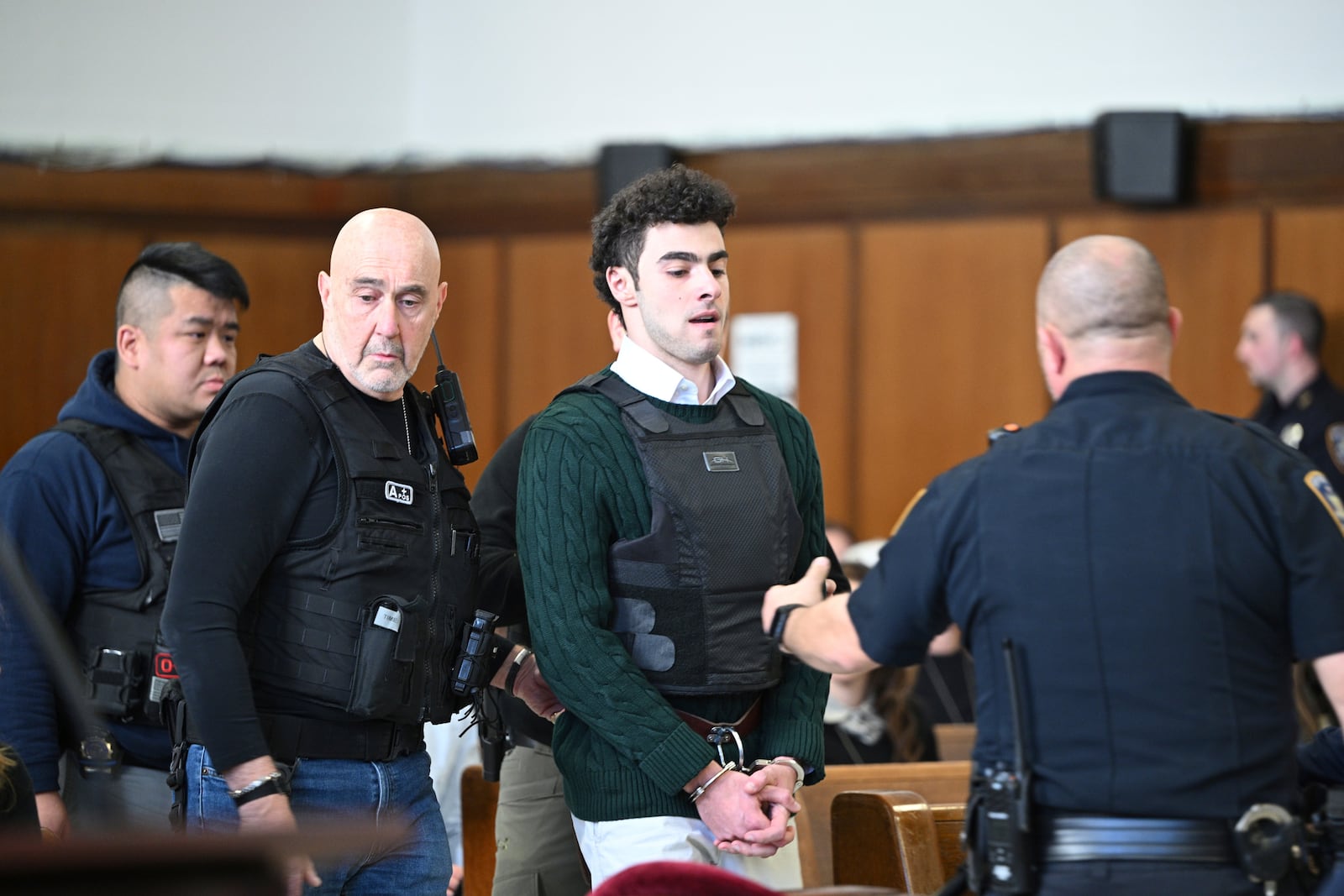 Luigi Mangione, accused of fatally shooting Brian Thompson, the CEO of UnitedHealthcare, appears in Manhattan state court in New York, Friday, Feb. 21, 2025. (Curtis Means/Pool Photo via AP)