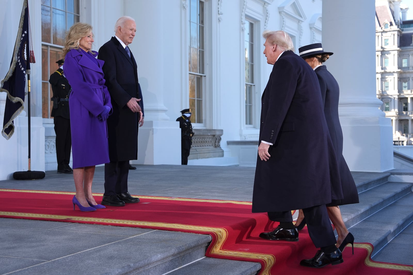 President Joe Biden, center left, and first lady Jill Biden, left, greet President-elect Donald Trump, center right, and Melania Trump, right, upon arriving at the White House, Monday, Jan. 20, 2025, in Washington. (AP Photo/Evan Vucci)