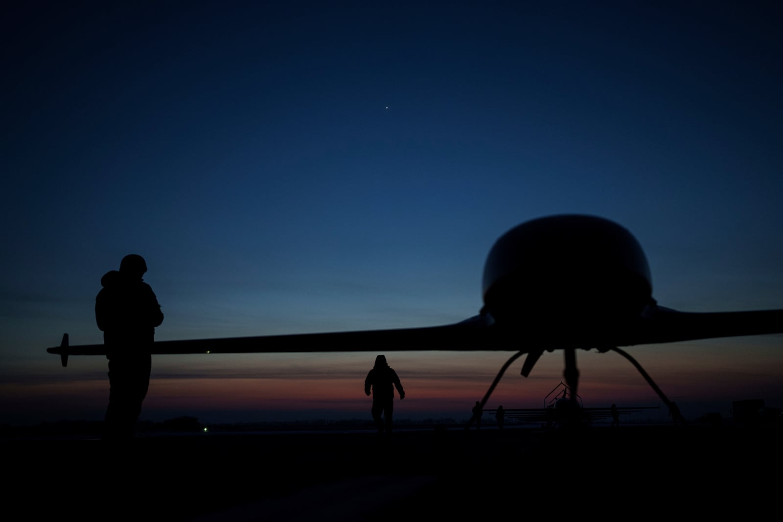 Ukrainian servicemen of the Defence Intelligence prepare to launch long-range drones An-196 Liutyi in undisclosed location, Ukraine, Feb. 28, 2025. (AP Photo/Evgeniy Maloletka)