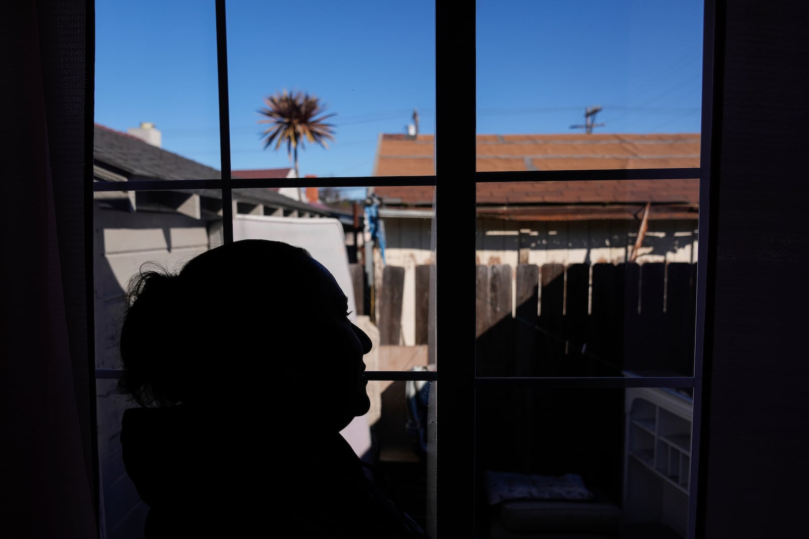 Carmen, who only shared her first name out of fear she could be targeted by immigration officials, is photographed at her apartment Wednesday, Jan. 22, 2025, in the San Francisco Bay Area. (AP Photo/Godofredo A. Vásquez)