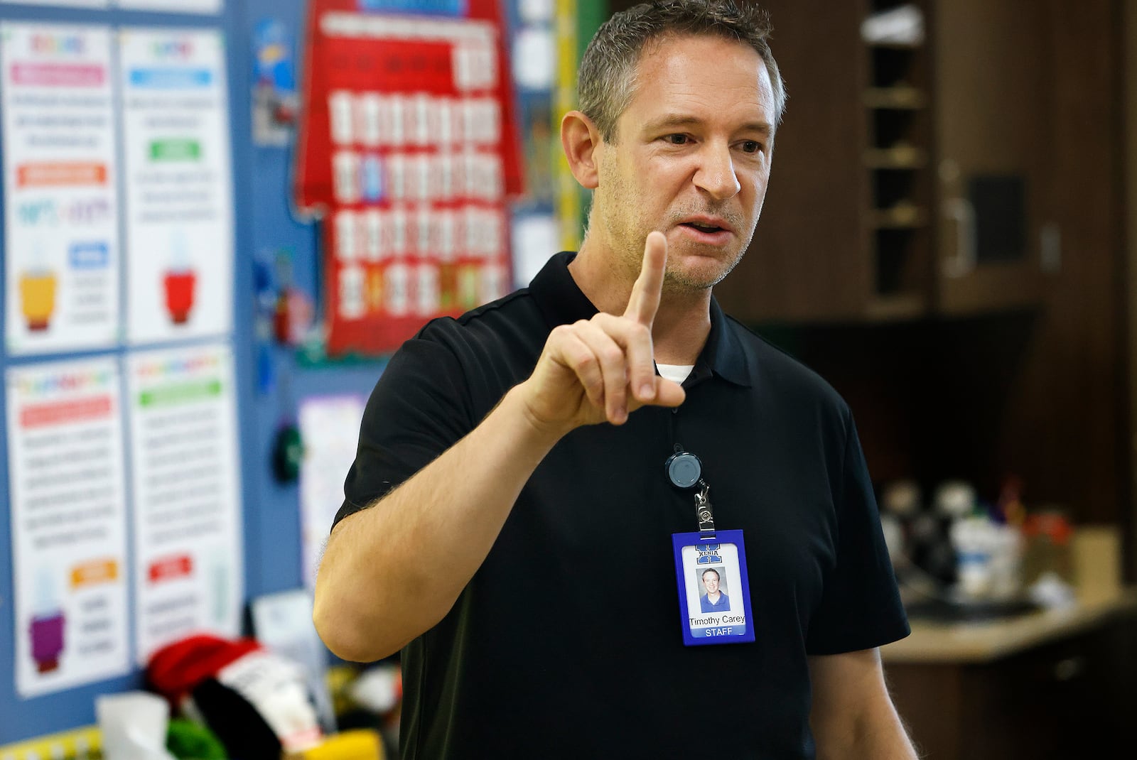 Tim Carey, the district's STEM career coach for Xenia schools works with students at McKinley Elementary Wednesday, Nov. 20, 2024. MARSHALL GORBY\STAFF