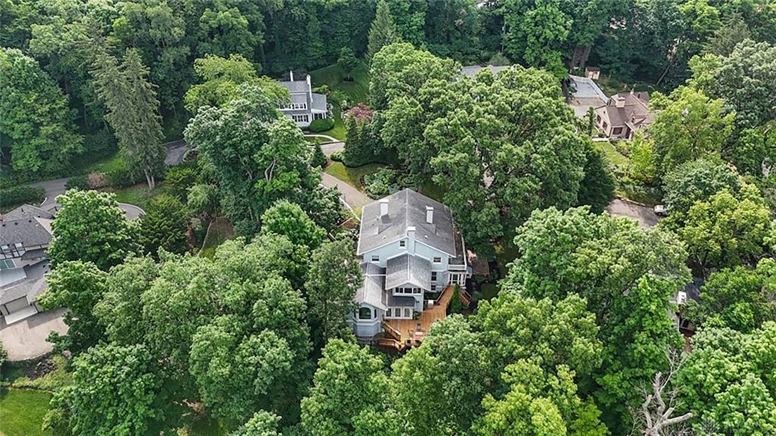 The home sits on a one acre, heavily wooded lot in the heart of Oakwood.