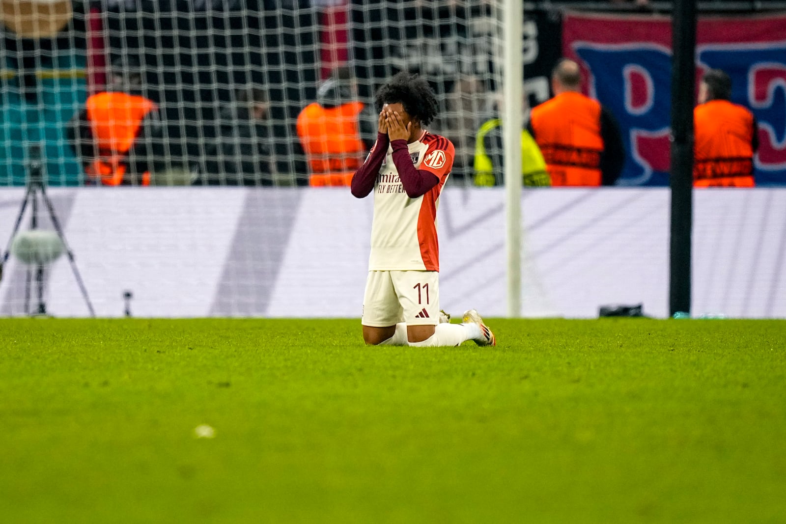 Lyon's Malick Fofana prays at the end of the Europa League round of 16, first leg soccer match between FCSB and Lyon at the National Arena stadium, Thursday, March 6, 2025. (AP Photo/Andreea Alexandru)