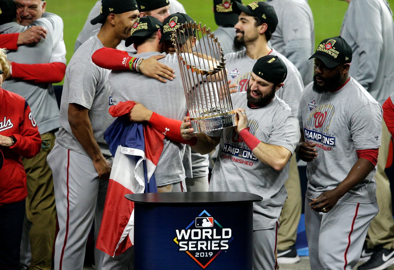 The Nationals' Adam Eaton holds the Commissioners Trophy after defeating the Houston Astros 6-2 in Game Seven to win the 2019 World Series in Game Seven of the 2019 World Series at Minute Maid Park on October 30, 2019 in Houston, Texas. (Photo by Bob Levey/Getty Images)