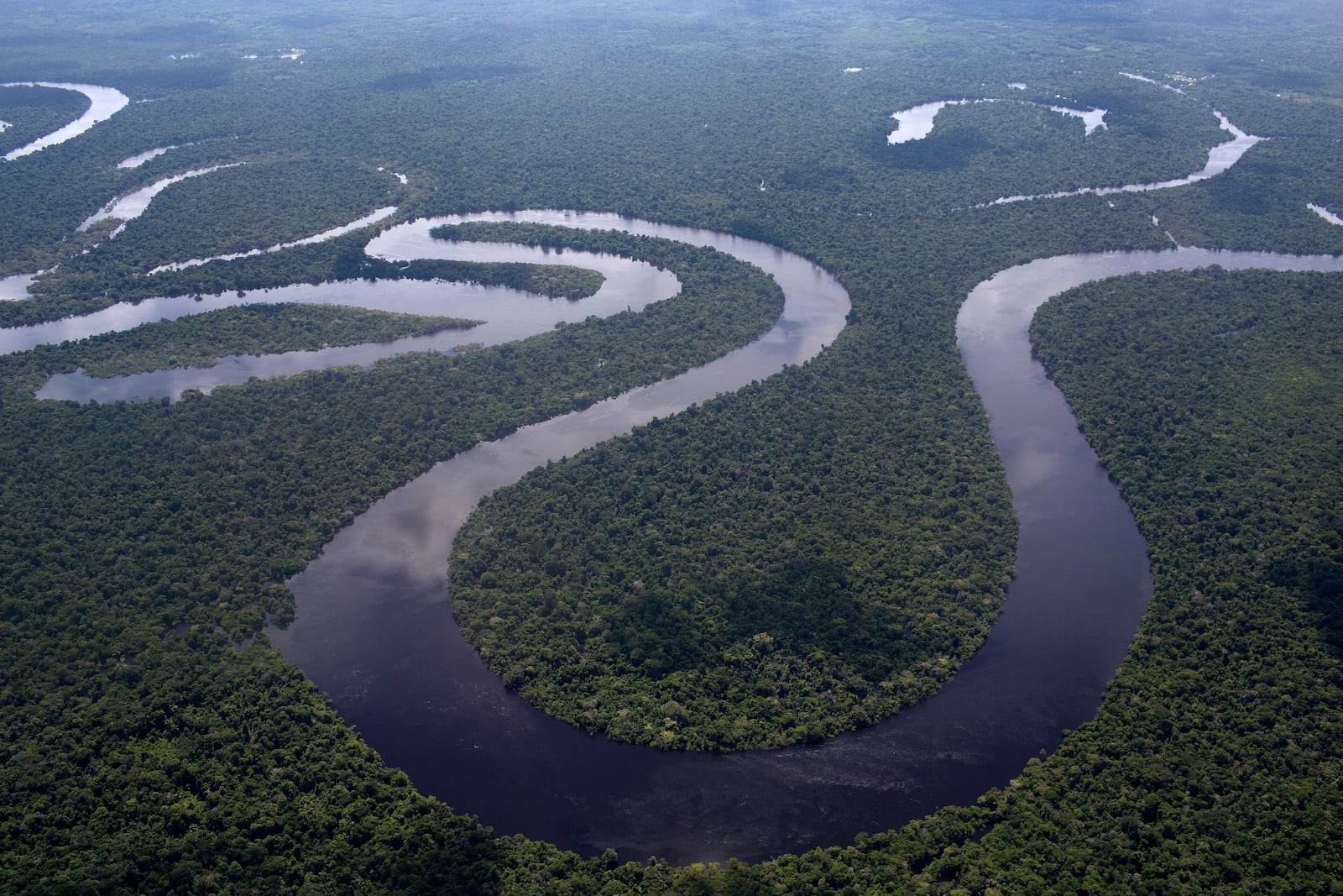 FILE - The Nanay River winding through Peru's Amazon jungle near Iquitos is seen on April 18, 2015. (AP Photo/Rodrigo Abd, File)