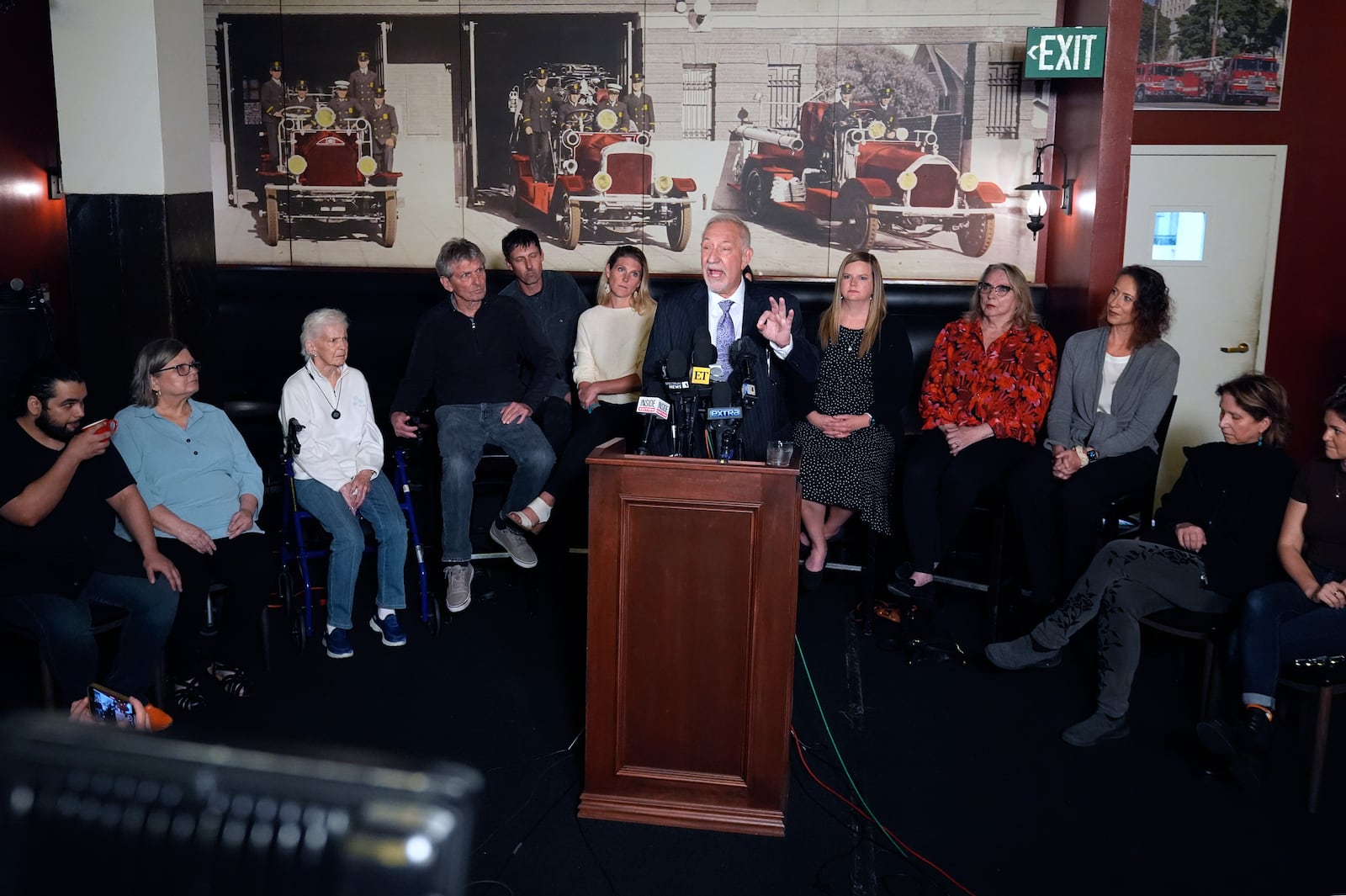 Mark Geragos defense attorney for Erik and Lyle Menendez surrounded by family members talks during a news conference on Thursday, Oct. 24, 2024, in Los Angeles. (AP Photo/Damian Dovarganes)