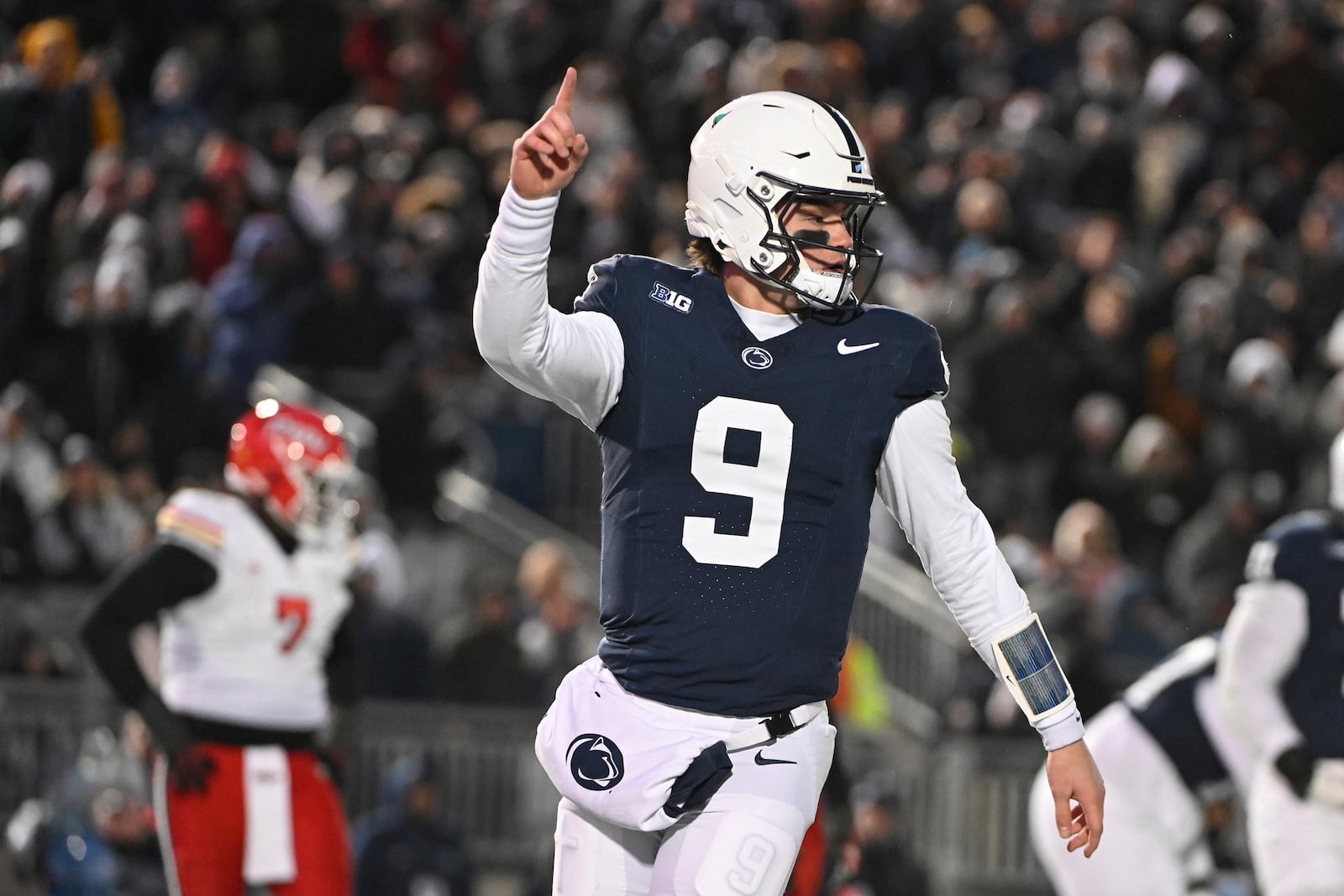 Penn State quarterback Beau Pribula (9) celebrates a touchdown against Maryland during the second quarter of an NCAA college football game, Saturday, Nov. 30, 2024, in State College, Pa. (AP Photo/Barry Reeger)