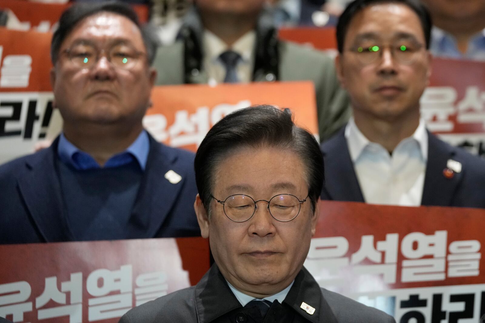 South Korea's main opposition Democratic Party leader Lee Jae-myung reacts during a press conference with his party members at the National Assembly in Seoul, South Korea, Saturday, Dec. 7, 2024. (AP Photo/Ahn Young-joon)