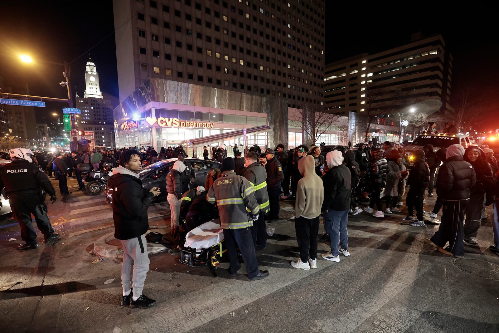 Police and emergency personnel assist multiple people who were struck by a car, at Broad and Spring Garden Street, while celebrating after the Eagles won the Washington Commanders vs. Philadelphia Eagles NFC Championship game in Philadelphia on Sunday, Jan. 26, 2025. (Elizabeth Robertson/The Philadelphia Inquirer via AP)