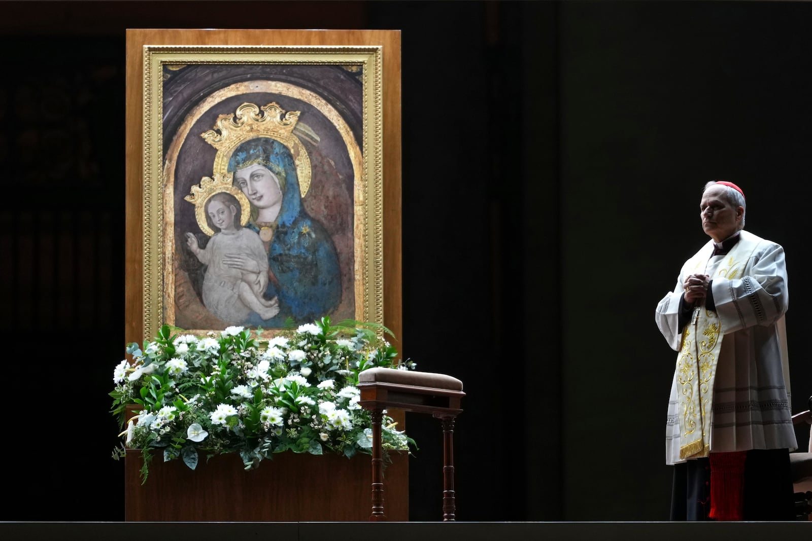 Cardinal Robert Francis Prevost, Prefect of the Dicastery for Bishops, leads the recitation of the Holy Rosary for Pope Francis' health in St Peter's Square at the Vatican, Monday, March 3, 2025. (AP Photo/Kirsty Wigglesworth)