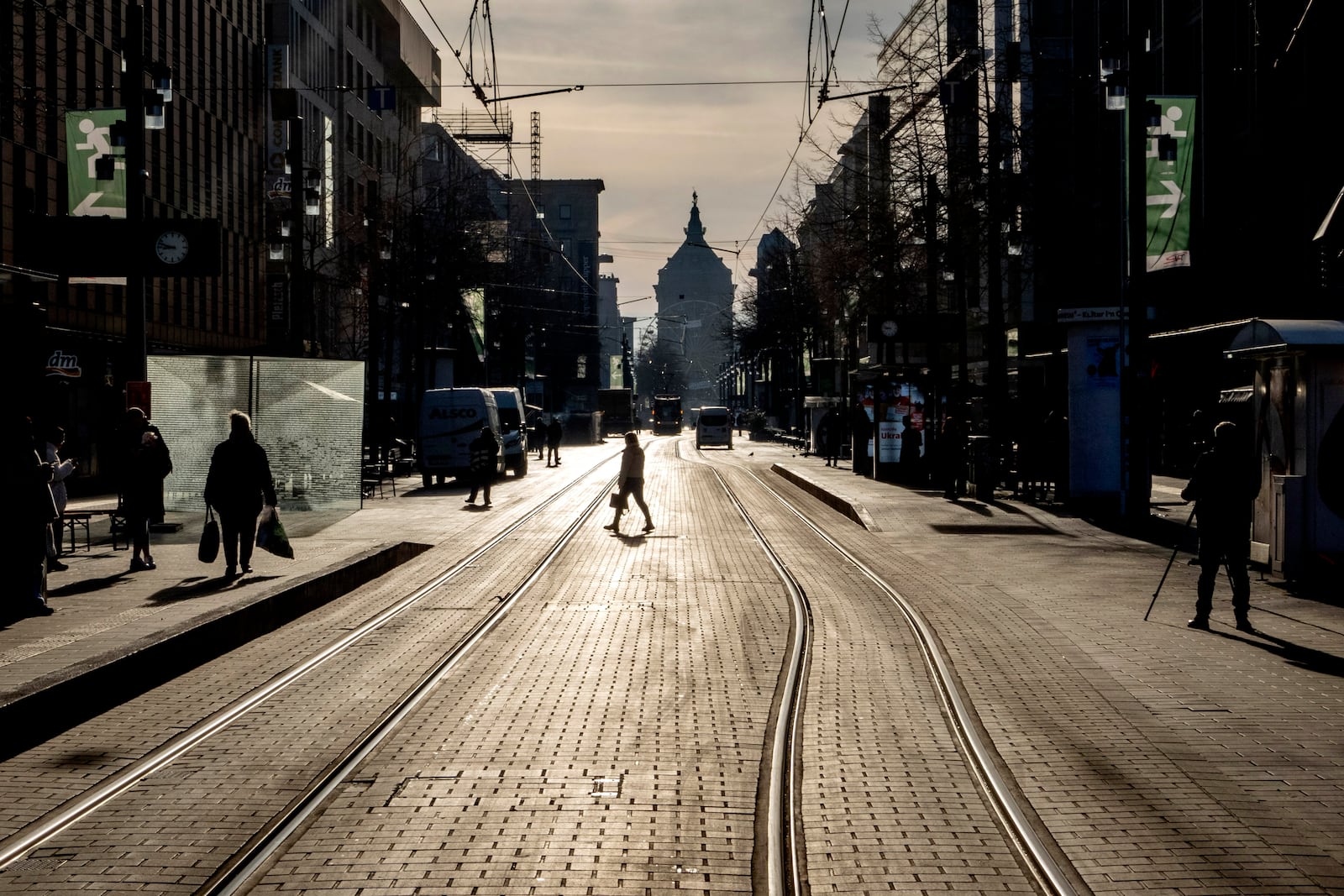 A person crosses the street in the city center of Mannheim, Germany, Tuesday, March 4, 2025, a day after a driver rammed a car into a crowd. (AP Photo/Michael Probst)