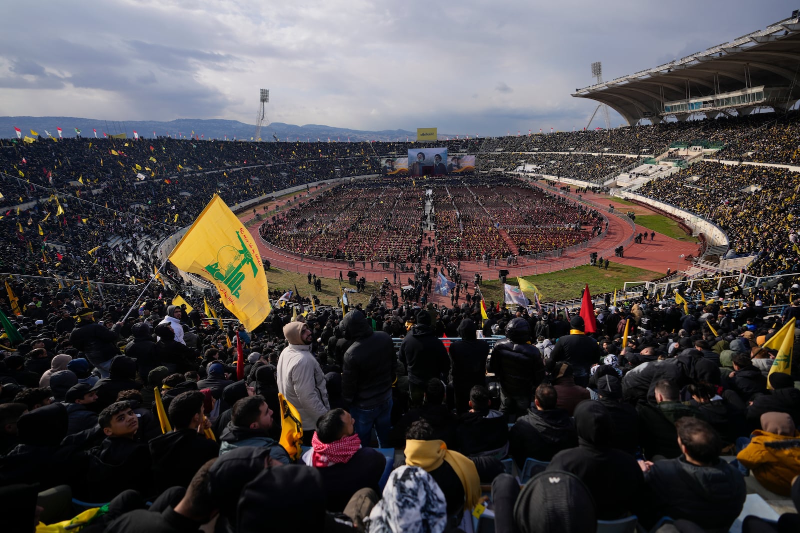 People gather for the funeral ceremony of the Lebanon's late Hezbollah leaders Hassan Nasrallah and Hashem Safieddine at the Sports City Stadium in Beirut, Lebanon, Sunday, Feb. 23, 2025. (AP Photo/Hassan Ammar)