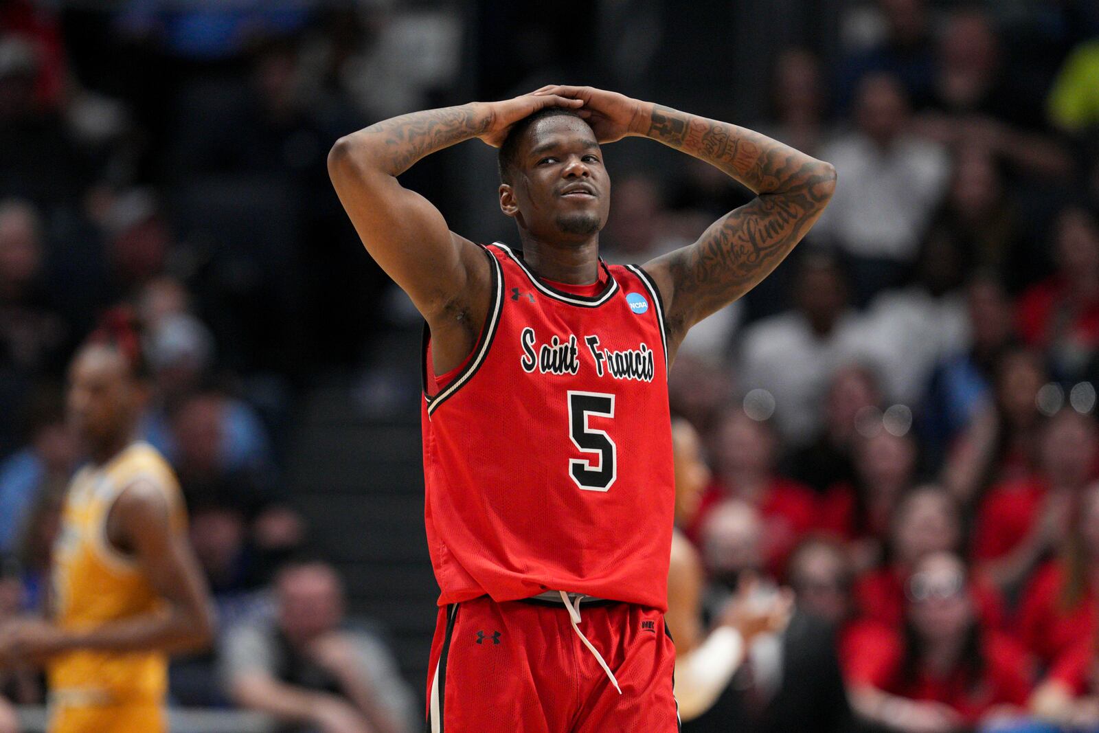 Saint Francis' Daemar Kelly reacts during the second half of a First Four college basketball game against the Alabama State in the NCAA Tournament, Tuesday, March 18, 2025, in Dayton, Ohio. (AP Photo/Jeff Dean)