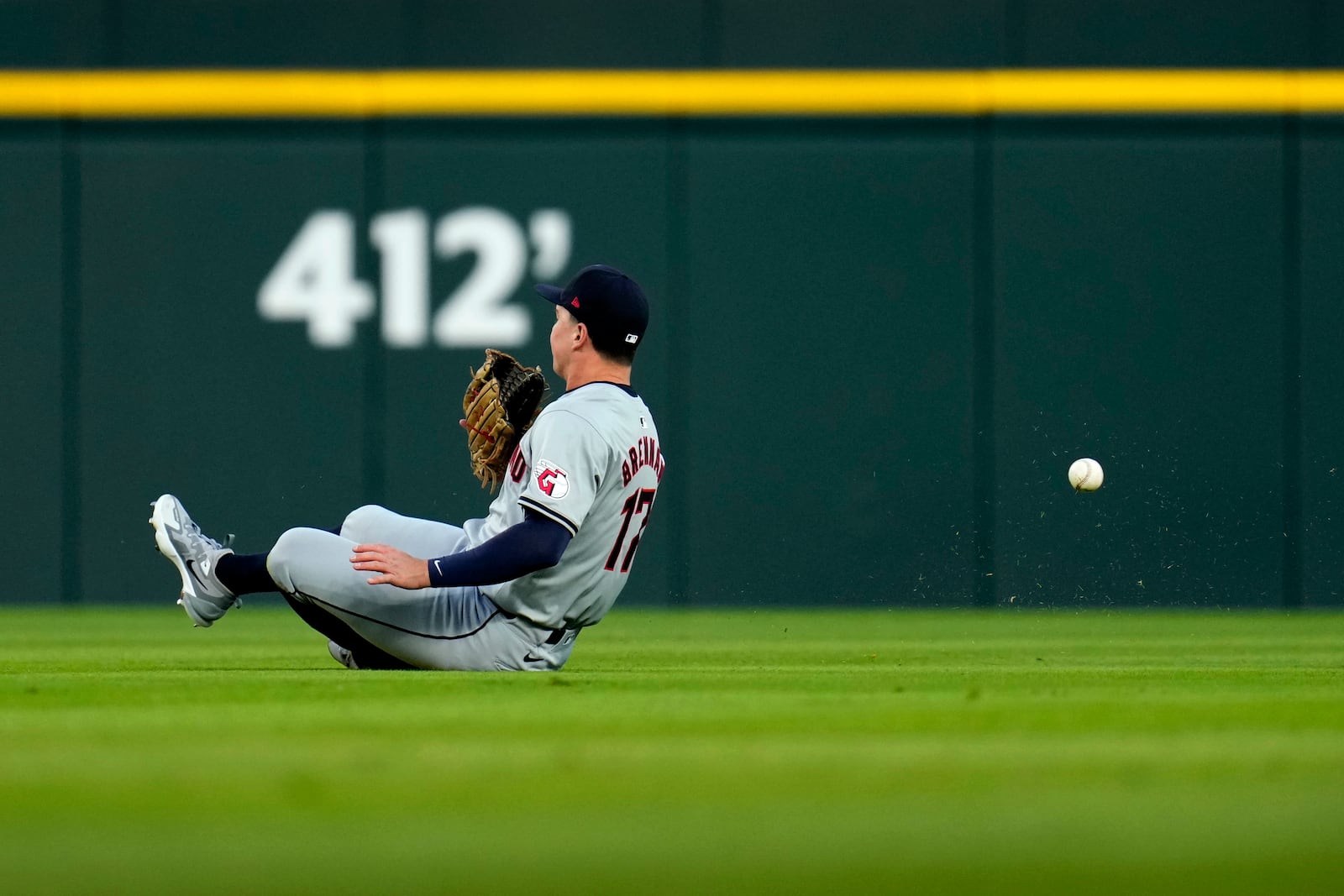 Cleveland Guardians right fielder Will Brennan makes a sliding attempt at a double by Detroit Tigers' Parker Meadows in the first inning during Game 4 of a baseball American League Division Series, Thursday, Oct. 10, 2024, in Detroit. (AP Photo/Paul Sancya)