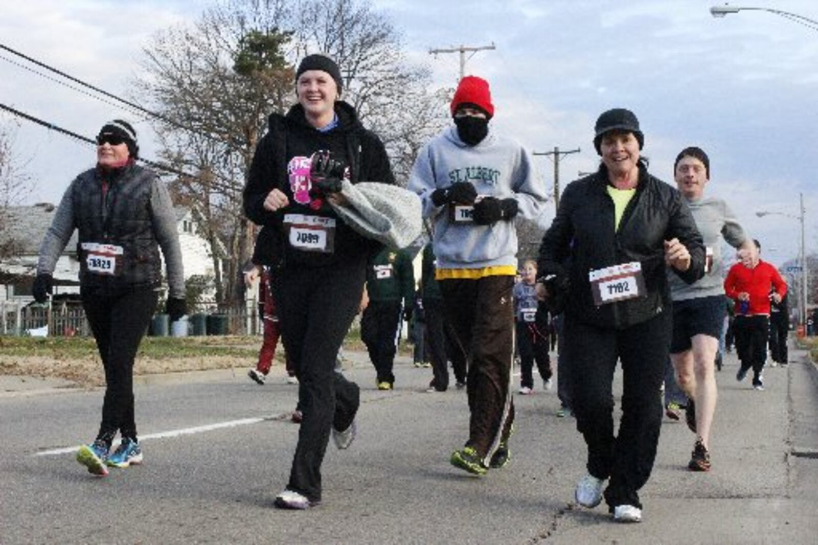 A record 10, 725 runners and walkers registered for the 35th Annual Ohio River Road Runners Club’s Turkey Trot held Thanksgving Day in Miamisburg. This was the first year of a new route for the course. Traffic for the fun run caused a bottleneck. Michael Franz / STAFF