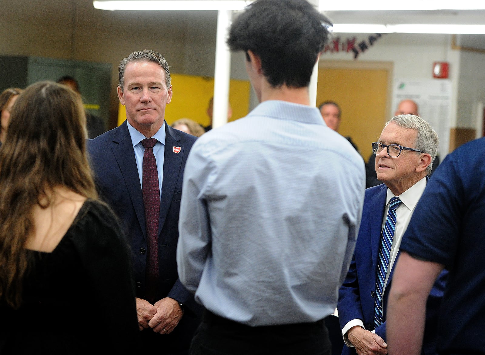 Ohio Lt. Gov. Jon Husted, left and Ohio Gov. Mike DeWine, talked with students and staff at Kettering Fairmont High School Friday, Nov. 3, 2023. Gov. DeWine announced that Kettering will receive $2.8 million to renovate and add space to the current mechanical engineering lab. MARSHALL GORBY\STAFF