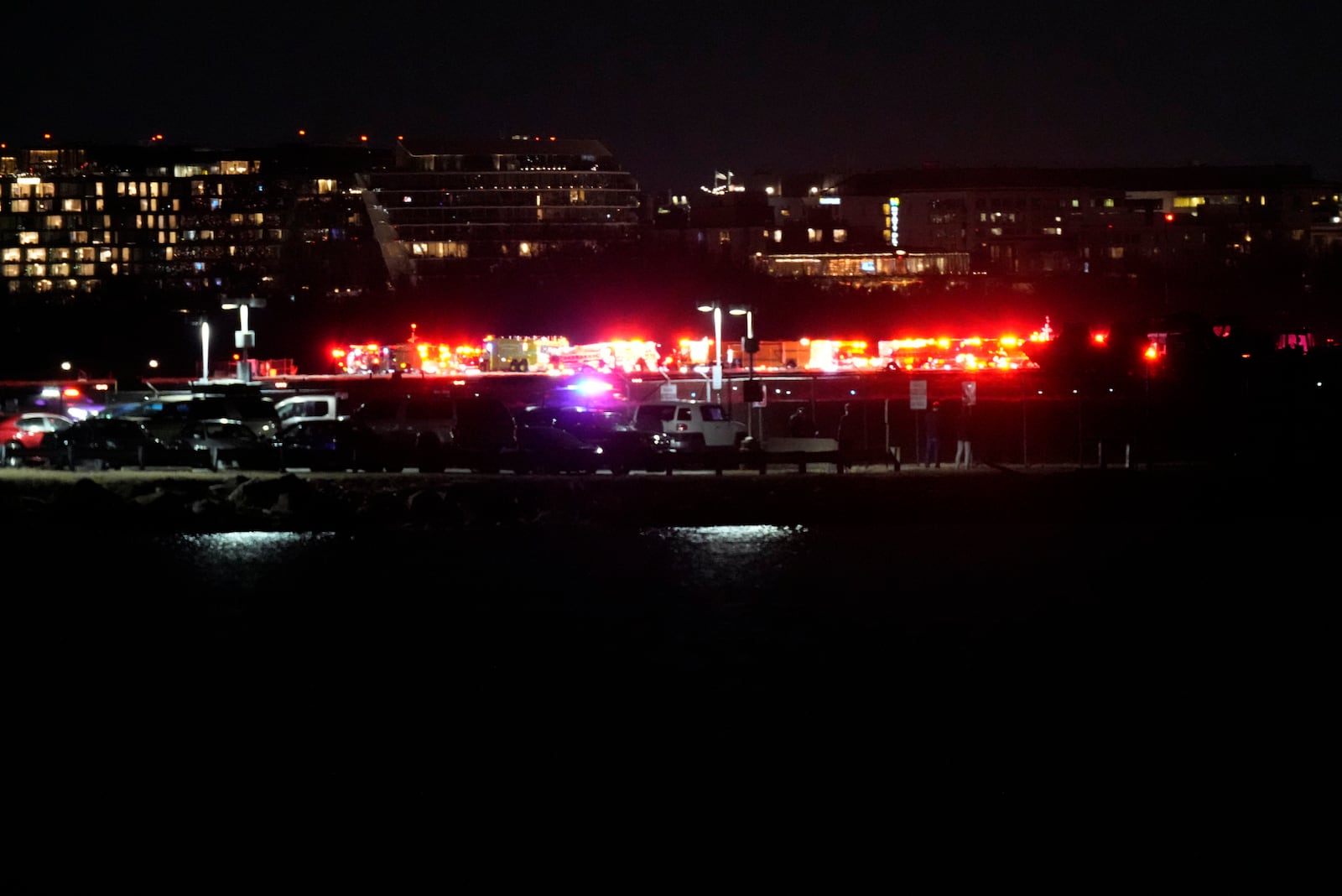 A view of emergency response looking from Arlington, Va., south of Ronald Reagan Washington National Airport, across the Potomac River toward the District of Columbia, Wednesday, Jan. 29, 2025. (AP Photo/Alex Brandon)