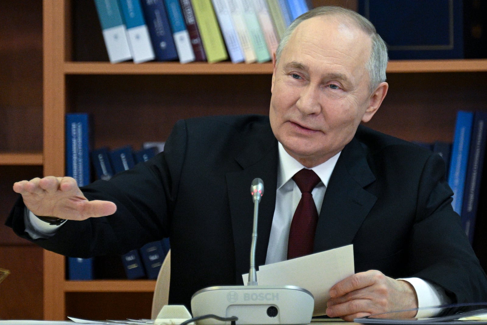 Russian President Vladimir Putin gestures while speaking during a meeting of the Board of Trustees of the Lomonosov Moscow State University in Moscow, Russia, Friday, Jan. 24, 2025. (Ramil Sitdikov, Sputnik, Kremlin Pool Photo via AP)