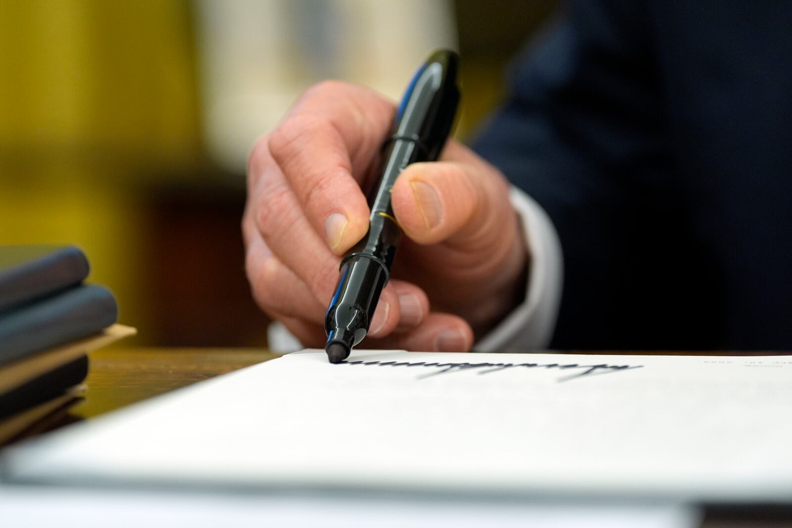 FILE - President Donald Trump signs an executive order in the Oval Office at the White House, Monday, Feb. 10, 2025, in Washington. (Photo/Alex Brandon, File)