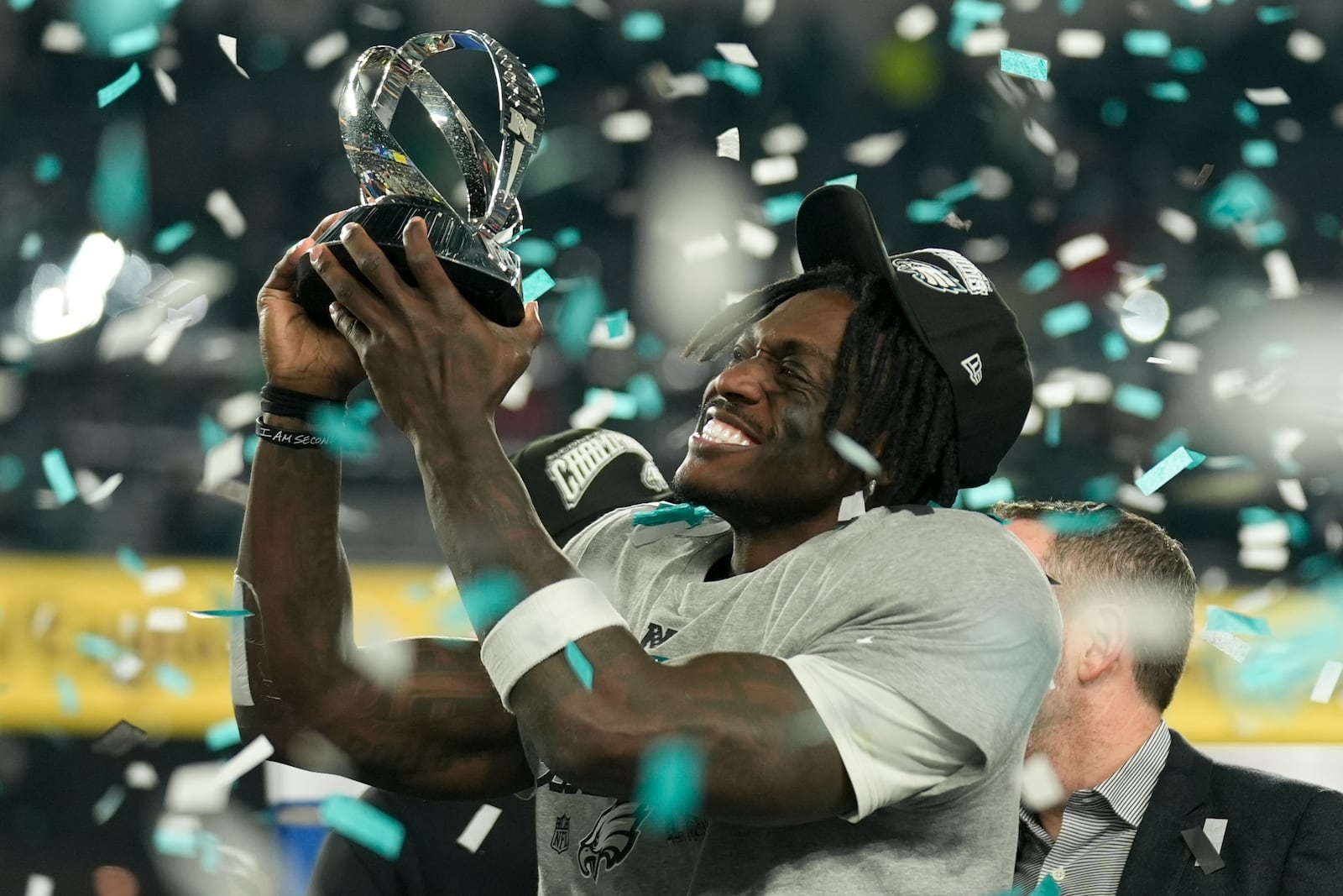 Philadelphia Eagles wide receiver A.J. Brown celebrates with the trophy after their win against the Washington Commanders in the NFC Championship NFL football game, Sunday, Jan. 26, 2025, in Philadelphia. (AP Photo/Seth Wenig)