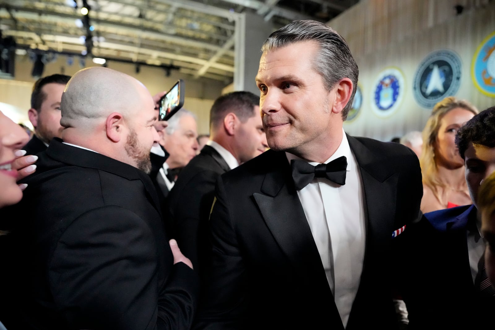 Defense Secretary nominee Pete Hegseth, center, attends the Commander in Chief Ball, Monday, Jan. 20, 2025, in Washington, after the 60th Presidential Inauguration. (AP Photo/Alex Brandon)