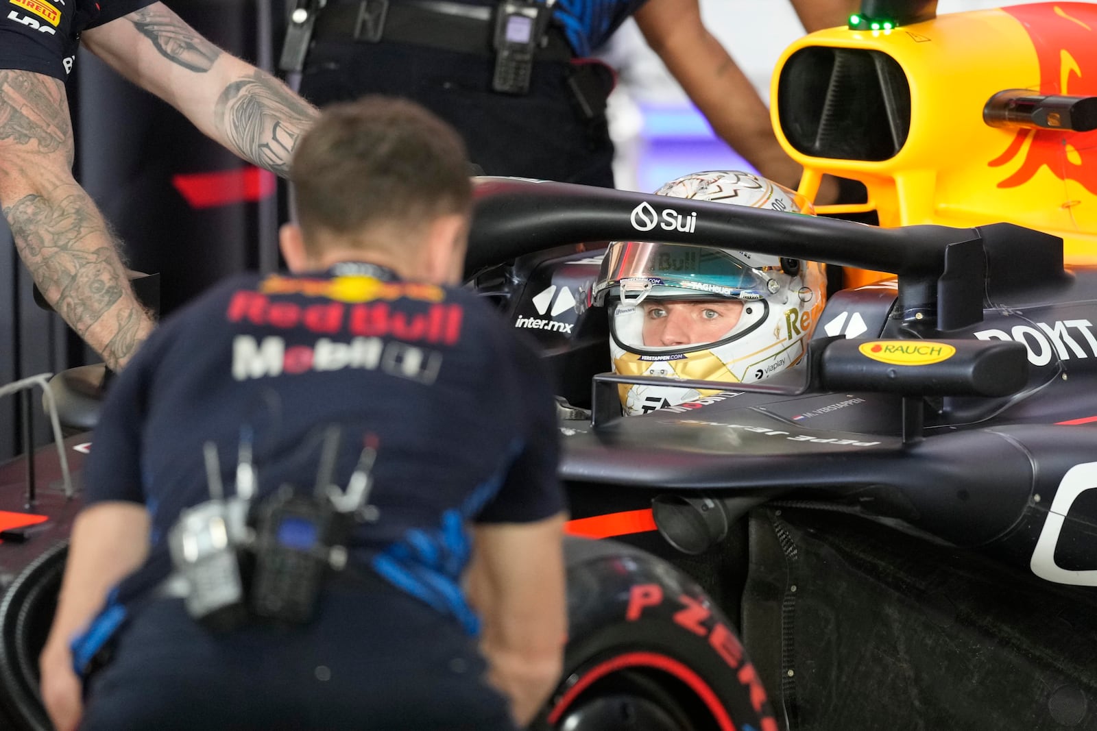 Red Bull driver Max Verstappen of the Netherlands at pit stop during the qualifying race at the Formula One Qatar Grand Prix, at the Lusail International Circuit in Lusail, Qatar, Saturday, Nov. 30, 2024. (AP Photo/ Darko Bandic, Pool)