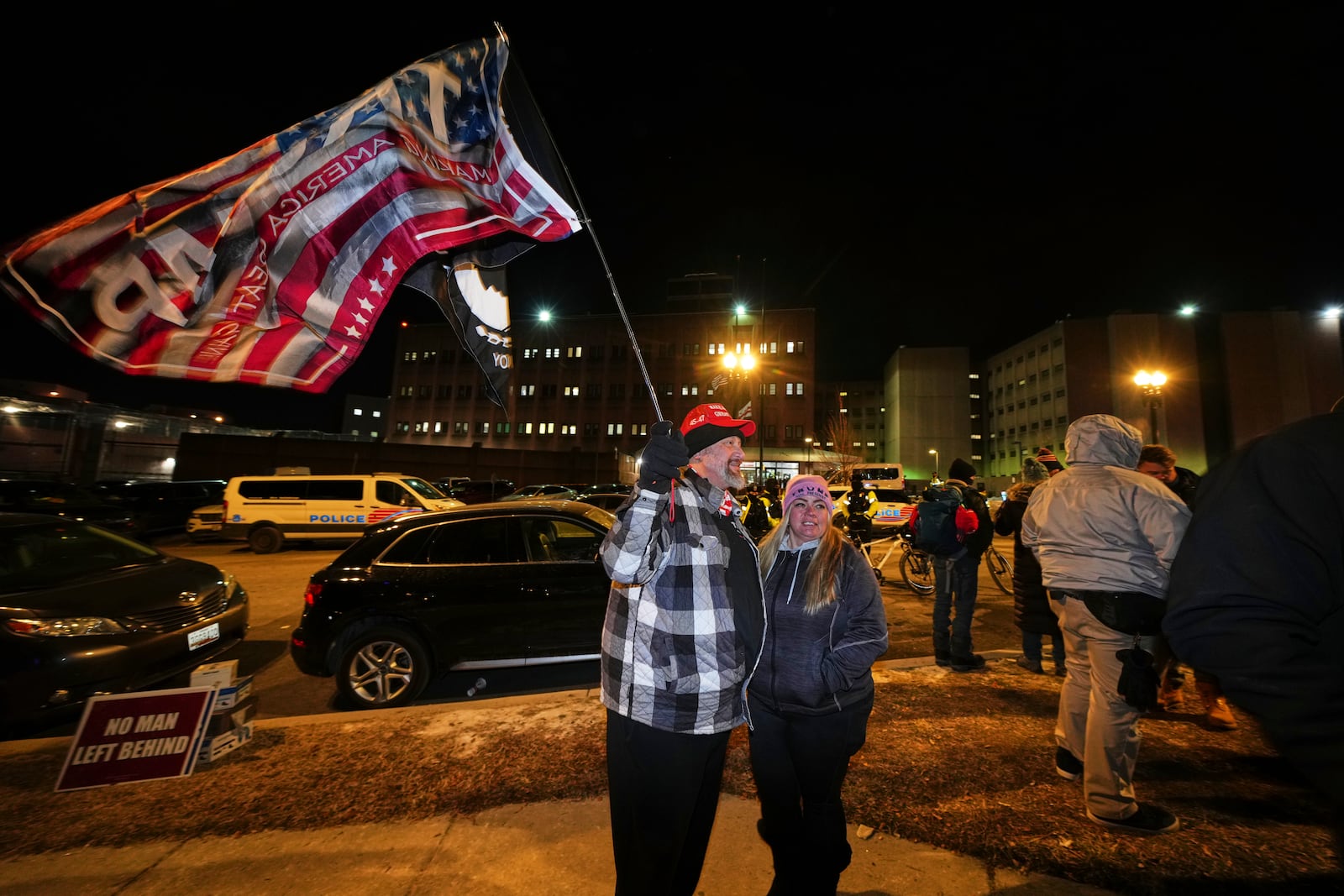 Supporters of President Donald Trump gather outside the DC Central Detention Facility, Monday, Jan. 20, 2025, in Washington. (AP Photo/Julio Cortez)