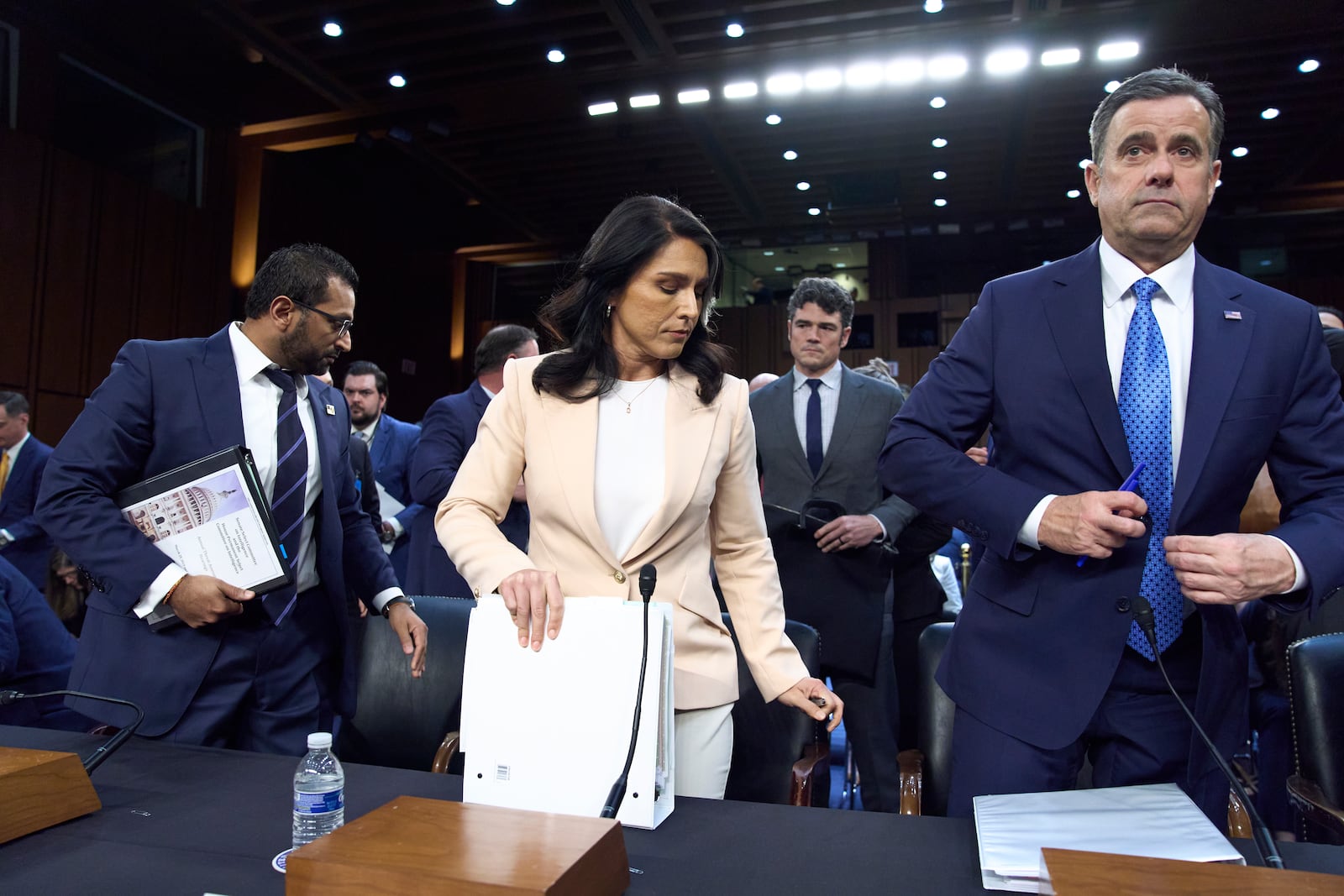 Director of National Intelligence Tulsi Gabbard, center, is flanked by FBI Director Kash Patel, left, and CIA Director John Ratcliffe, as the Senate Intelligence Committee holds its worldwide threats hearing, on Capitol Hill in Washington, Tuesday, March 25, 2025. (AP Photo/J. Scott Applewhite)