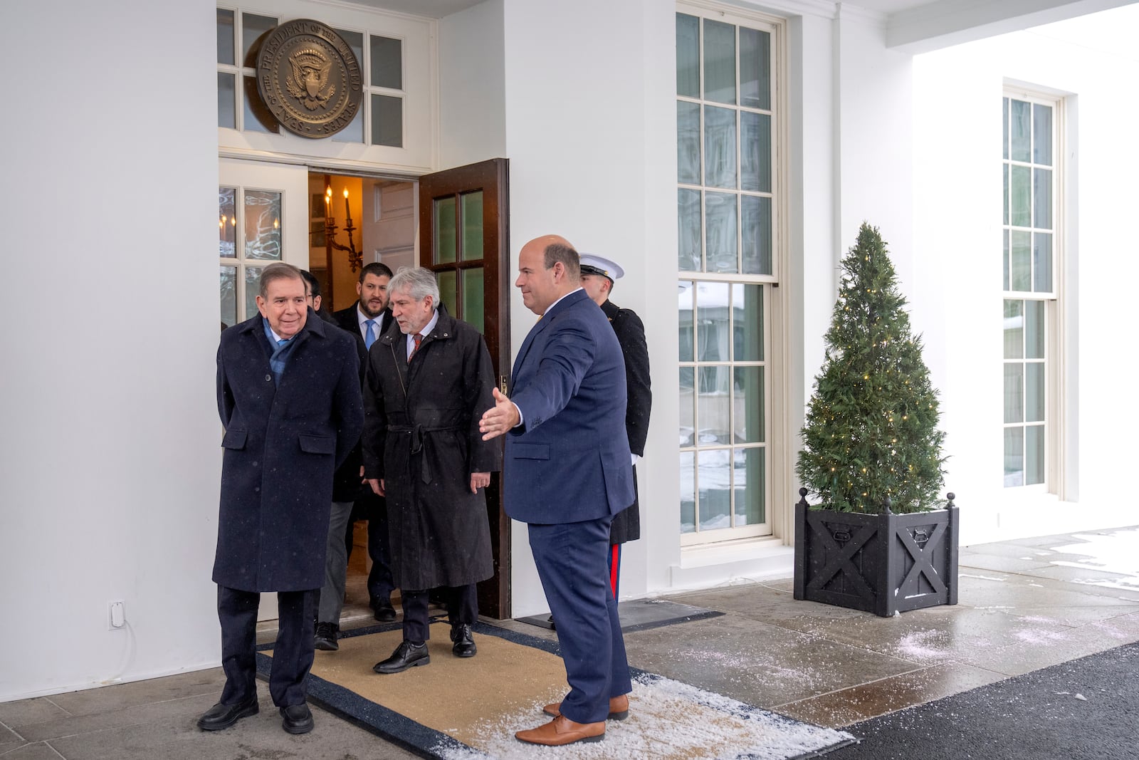 Venezuela's opposition leader Edmundo Gonzalez, left, arrives to speak with reporters at the White House, Monday, Jan. 6, 2025, in Washington. (AP Photo/Mark Schiefelbein)