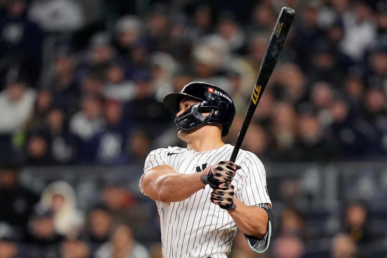 New York Yankees' Giancarlo Stanton watches his home run against the Cleveland Guardians during the seventh inning in Game 1 of the baseball AL Championship Series Monday, Oct. 14, 2024, in New York. (AP Photo/Frank Franklin II)